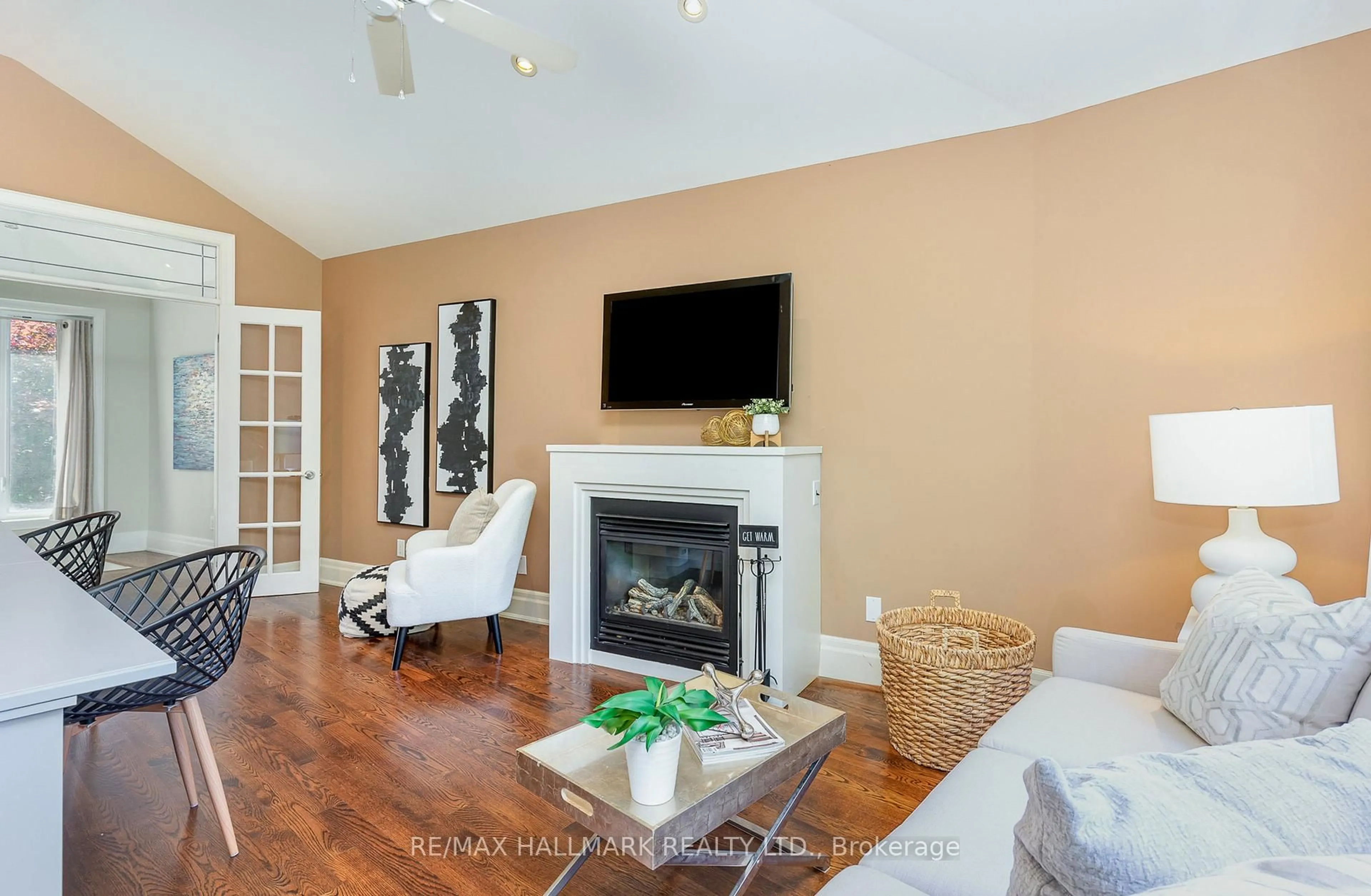 Living room with furniture, wood/laminate floor for 7 Tizzard Ave, Toronto Ontario M8Y 3Z4