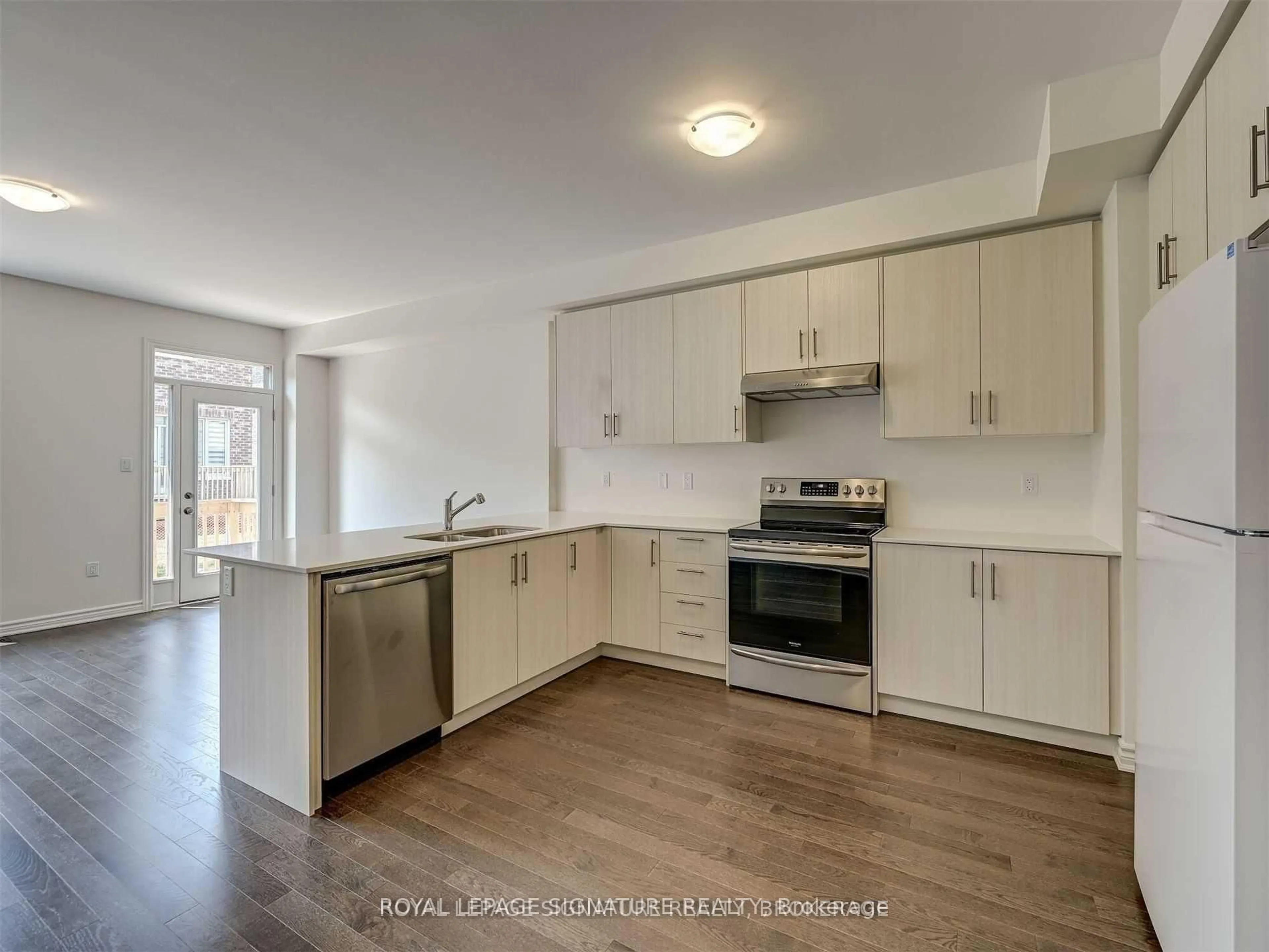 Open concept kitchen, wood/laminate floor for 1183 Restivo Lane, Milton Ontario L9T 2X5
