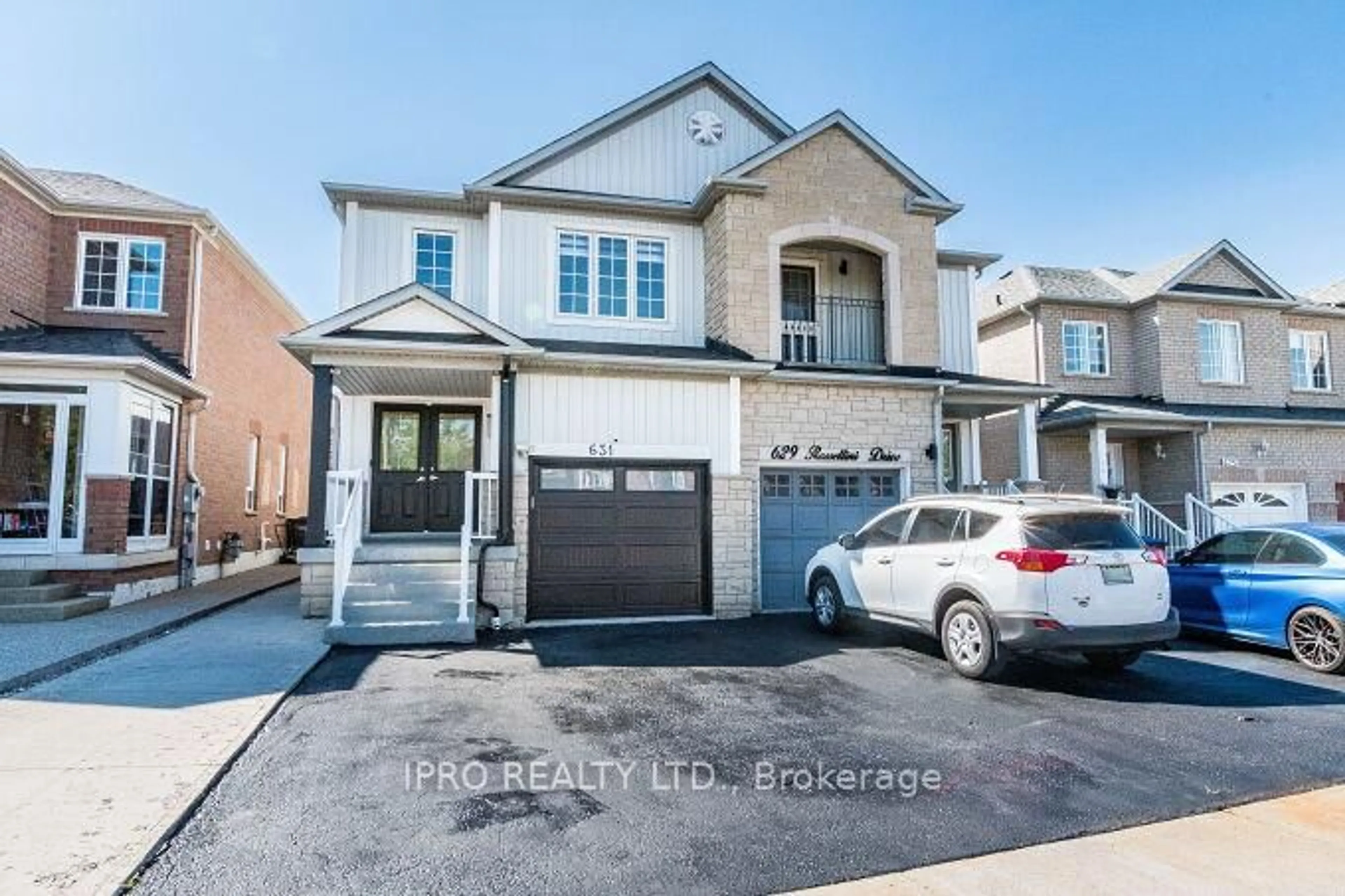 Home with brick exterior material, street for 631 Rossellini Dr, Mississauga Ontario L5W 1K9