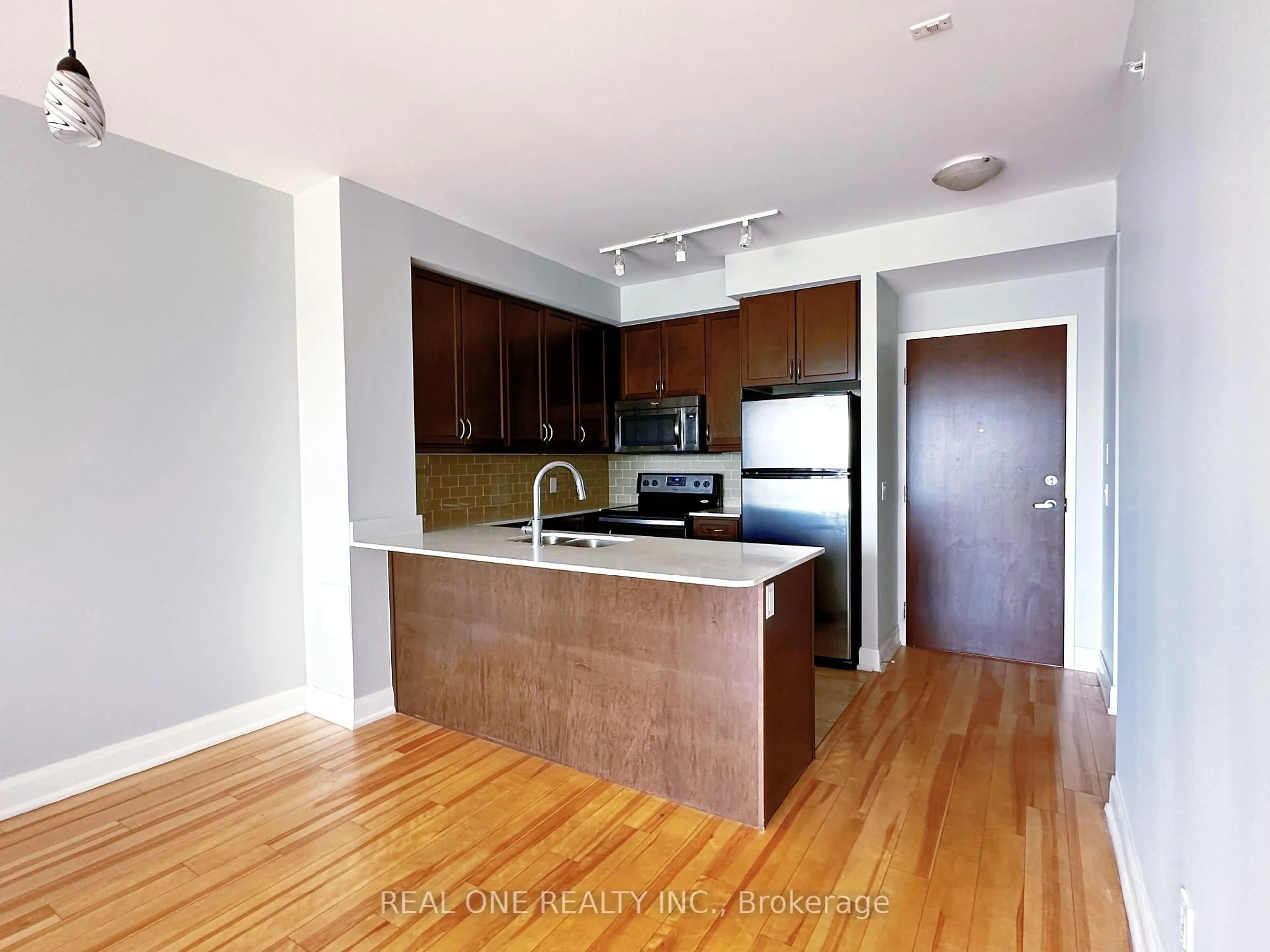 Open concept kitchen, wood/laminate floor for 2480 Prince Michael Dr #216, Oakville Ontario L6H 0E9