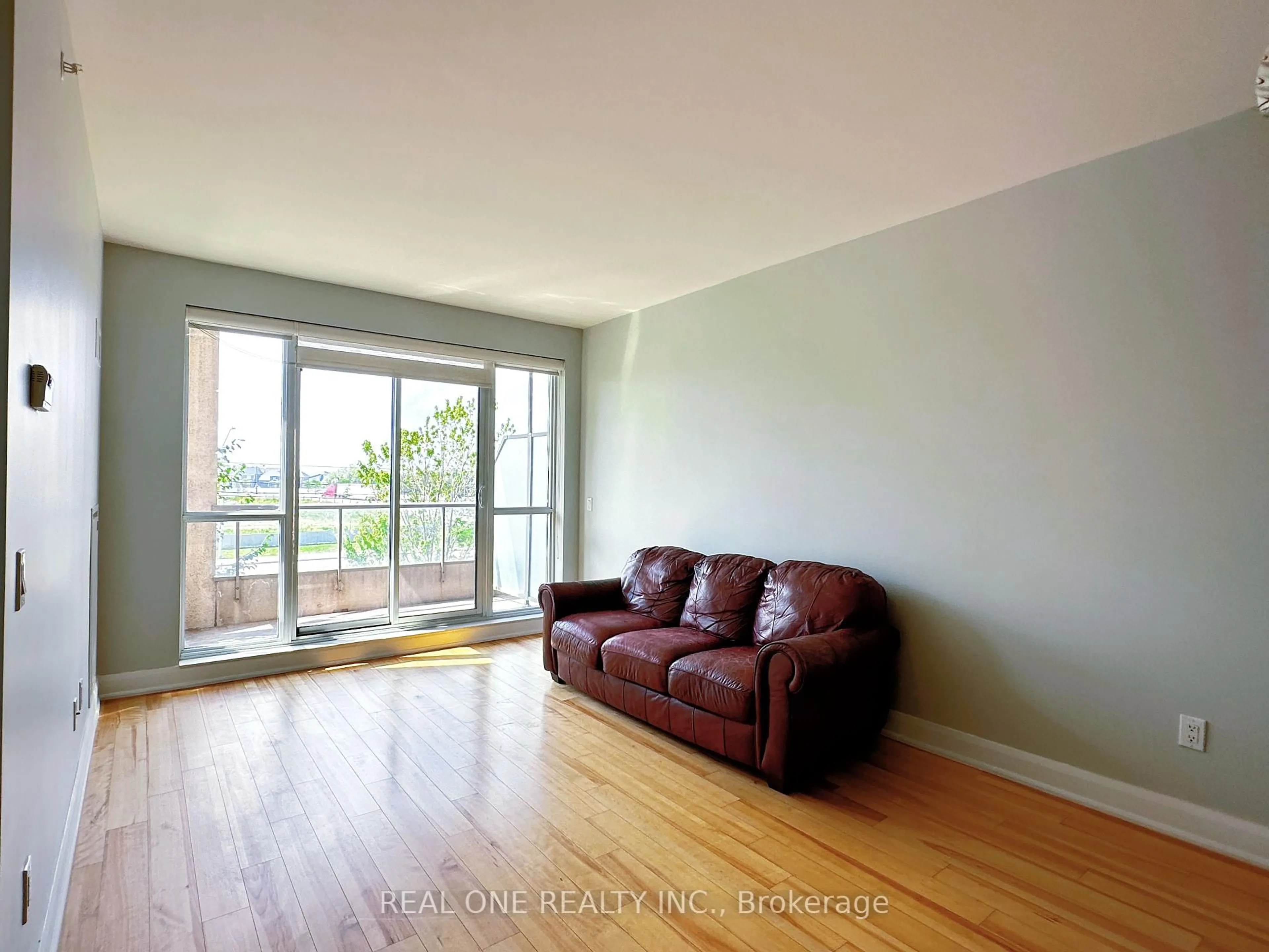 Living room with furniture, wood/laminate floor for 2480 Prince Michael Dr #216, Oakville Ontario L6H 0E9