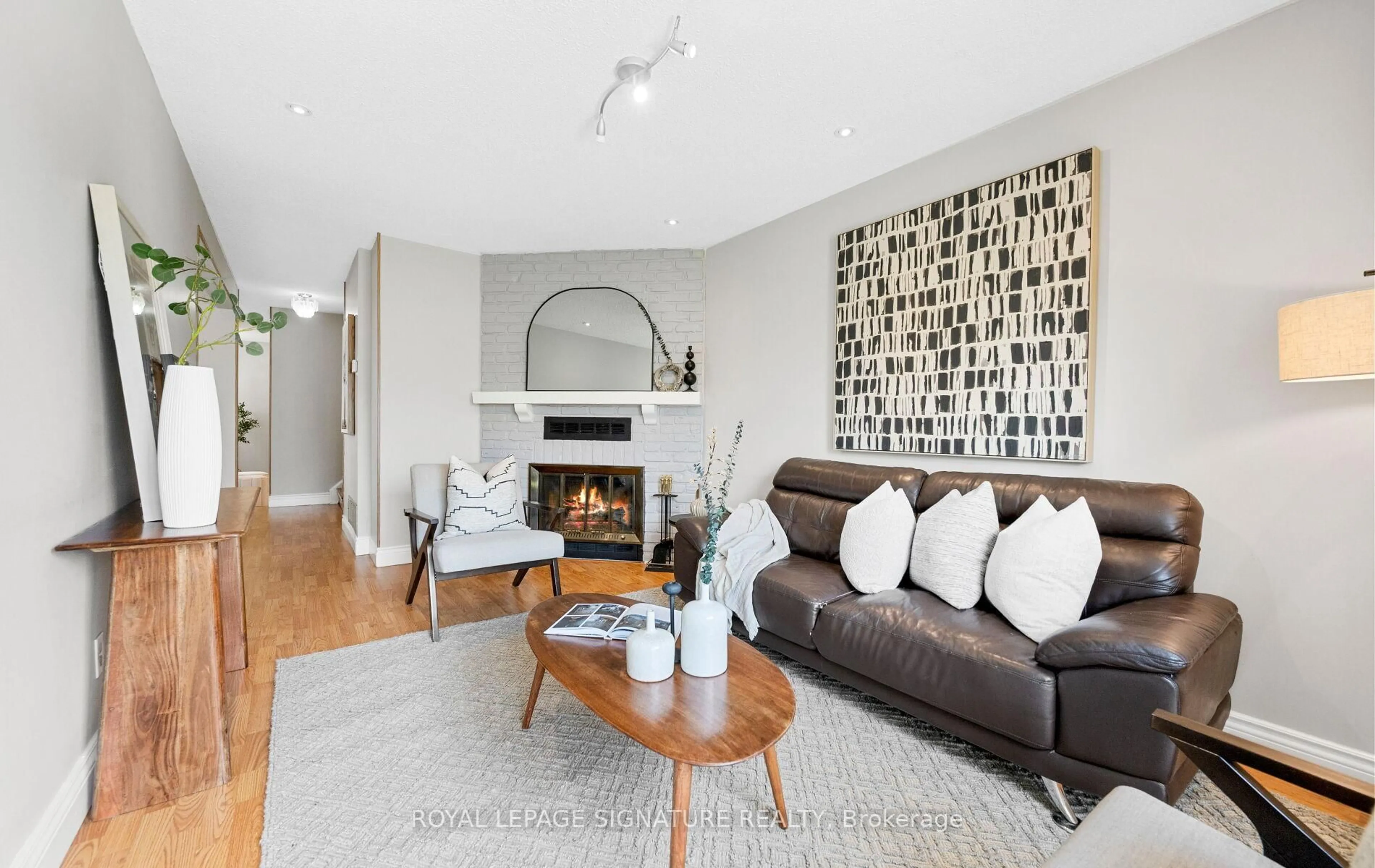 Living room with furniture, wood/laminate floor for 638 Galloway Cres, Mississauga Ontario L5C 3W1