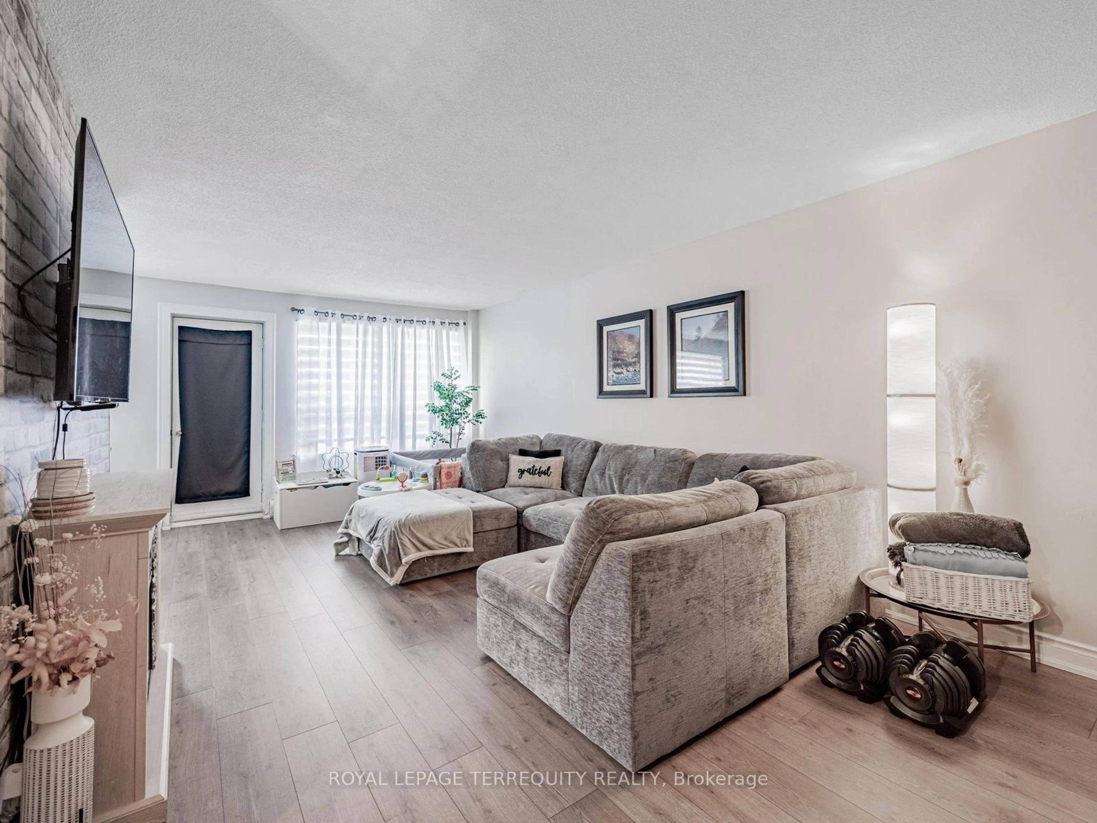 Living room with furniture, unknown for 2411 New St #205, Burlington Ontario L7R 1K2