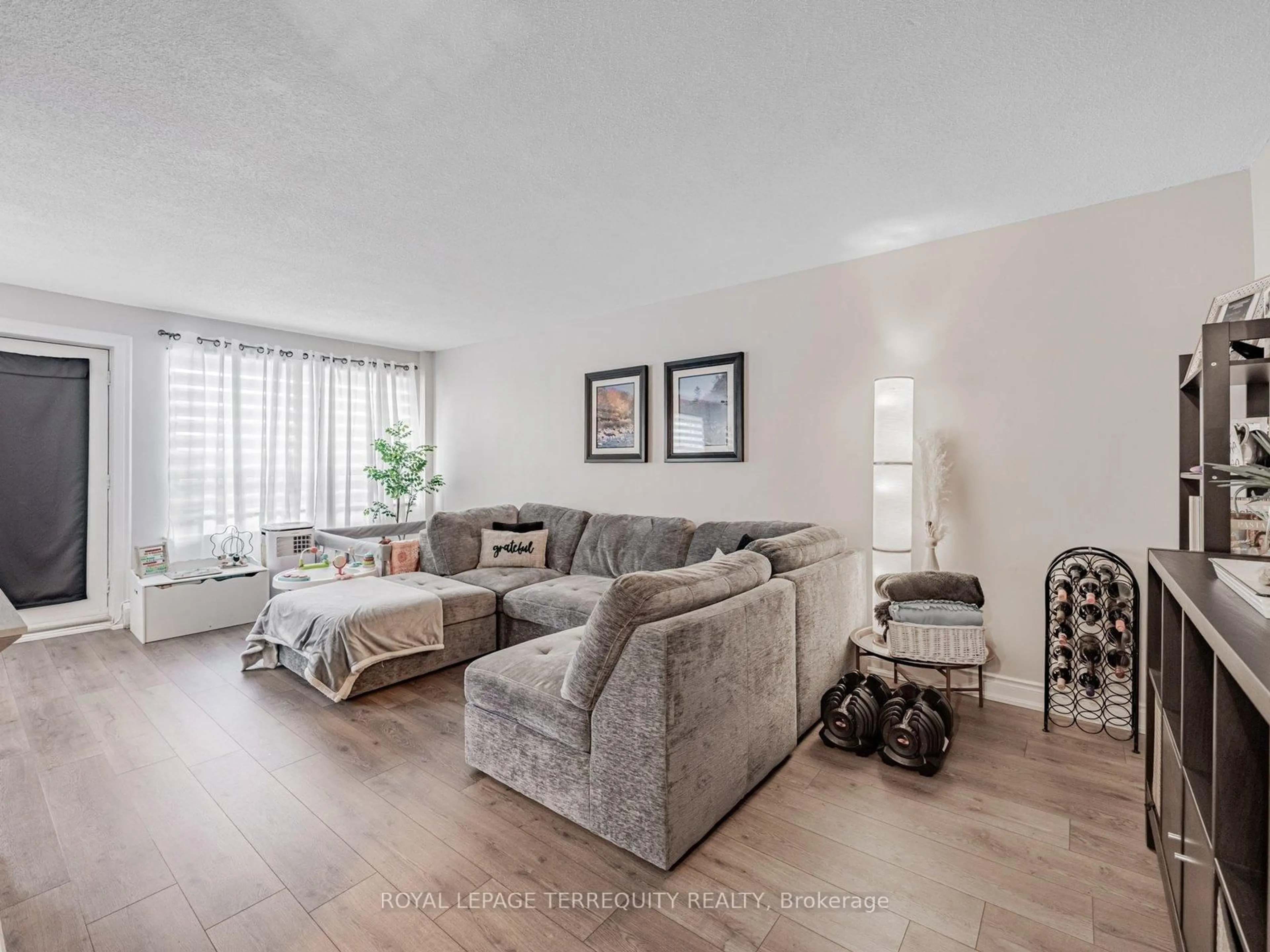 Living room with furniture, unknown for 2411 New St #205, Burlington Ontario L7R 1K2