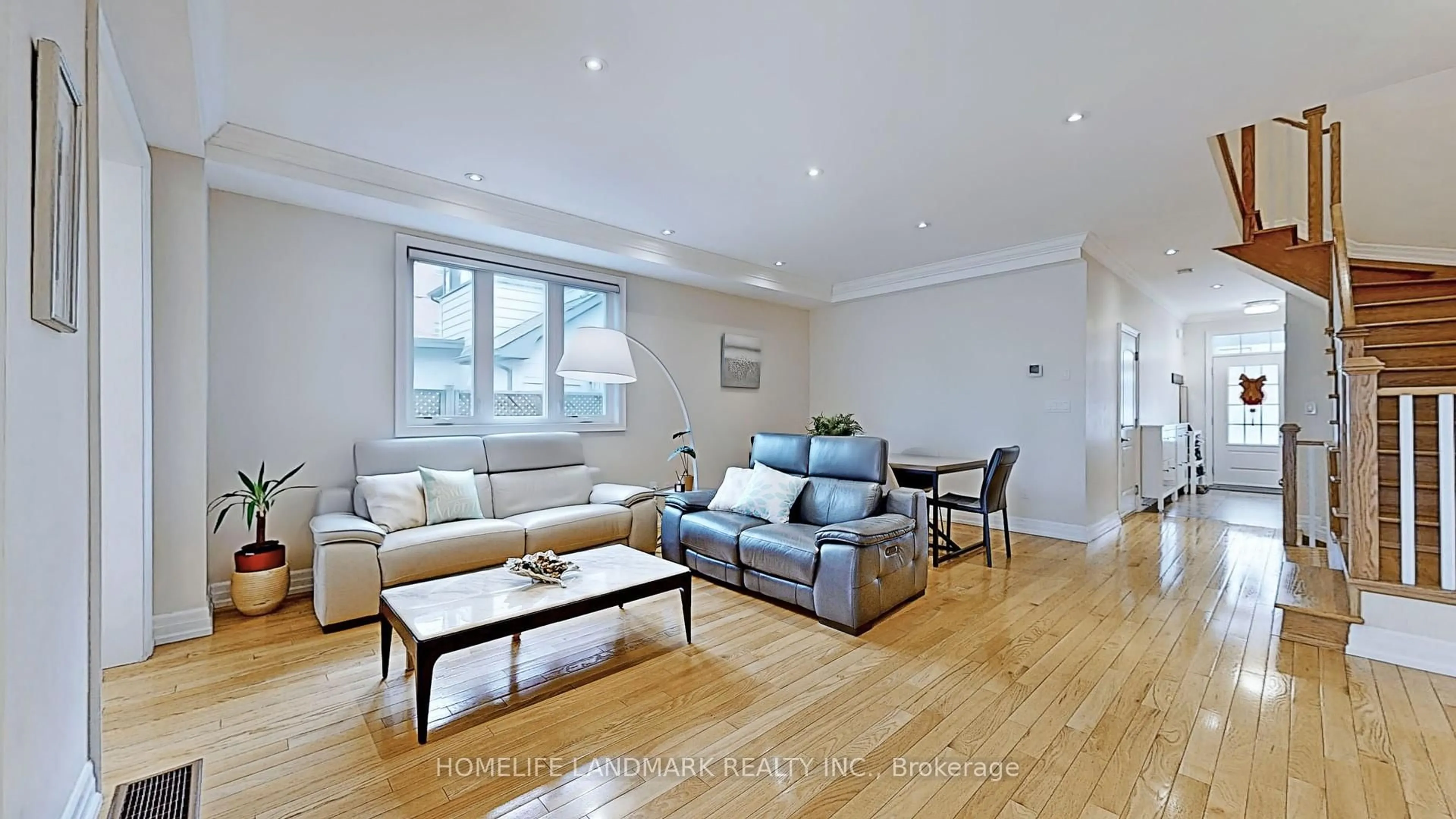 Living room with furniture, wood/laminate floor for 64 Forest Ave, Mississauga Ontario L5G 1L2