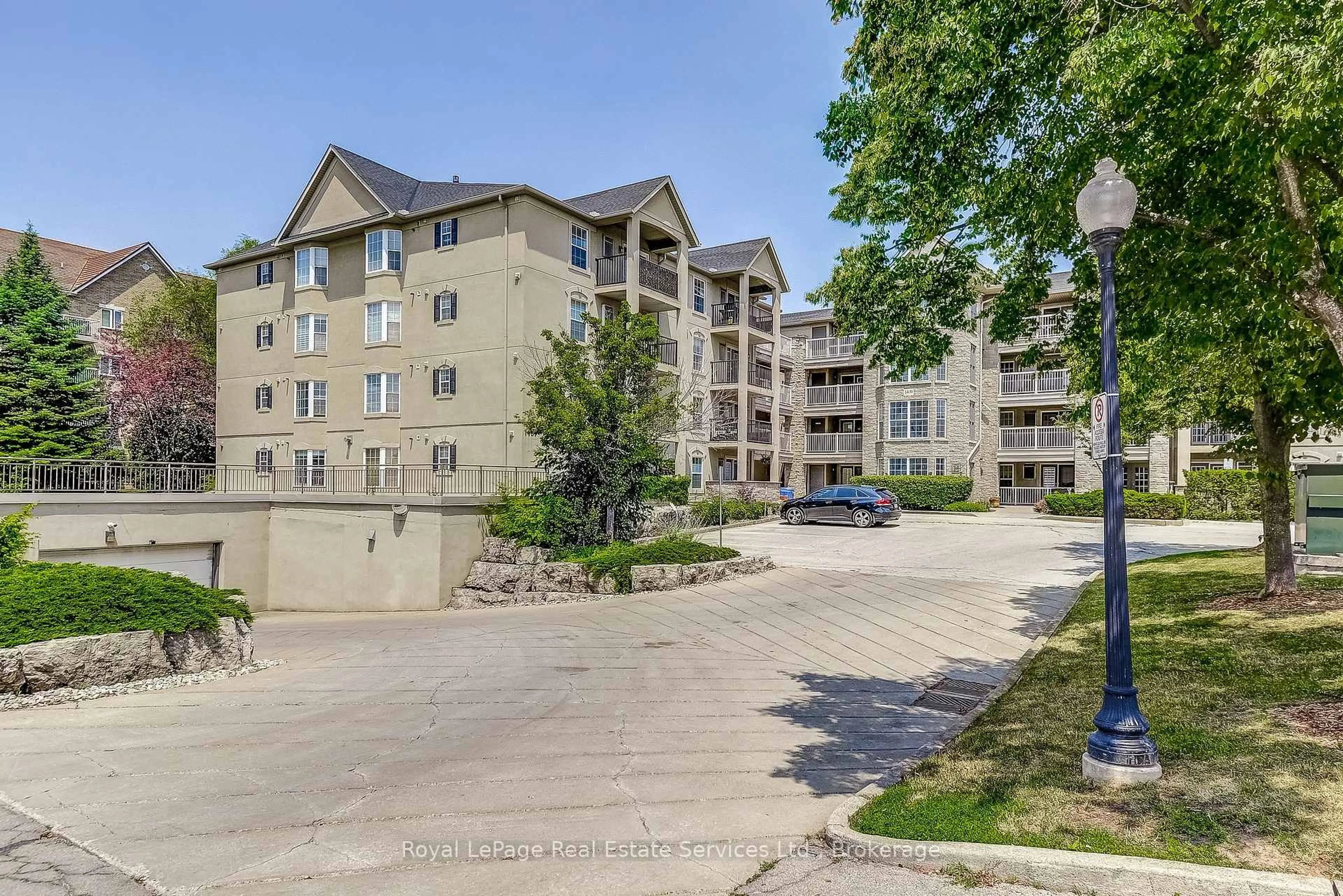 A pic from outside/outdoor area/front of a property/back of a property/a pic from drone, unknown for 1431 Walkers Line #411, Burlington Ontario L7M 4P3