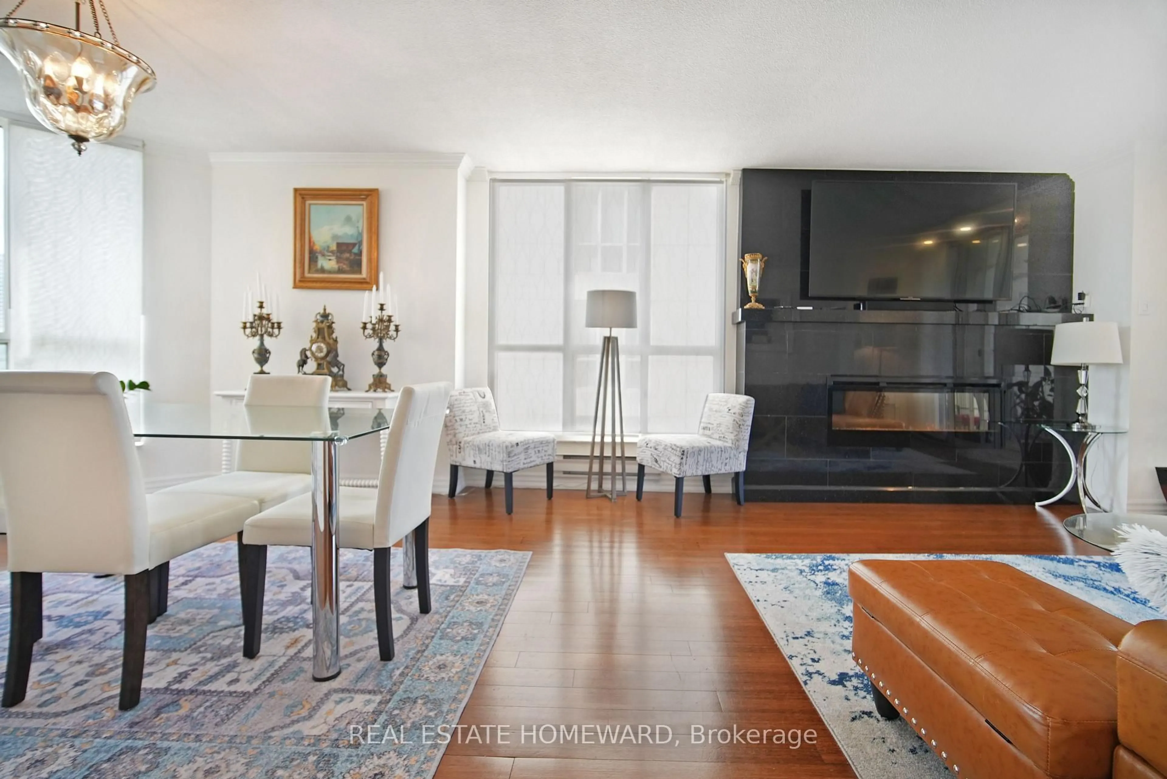 Living room with furniture, wood/laminate floor for 2285 Lake Shore Blvd #707, Toronto Ontario M8V 3X9