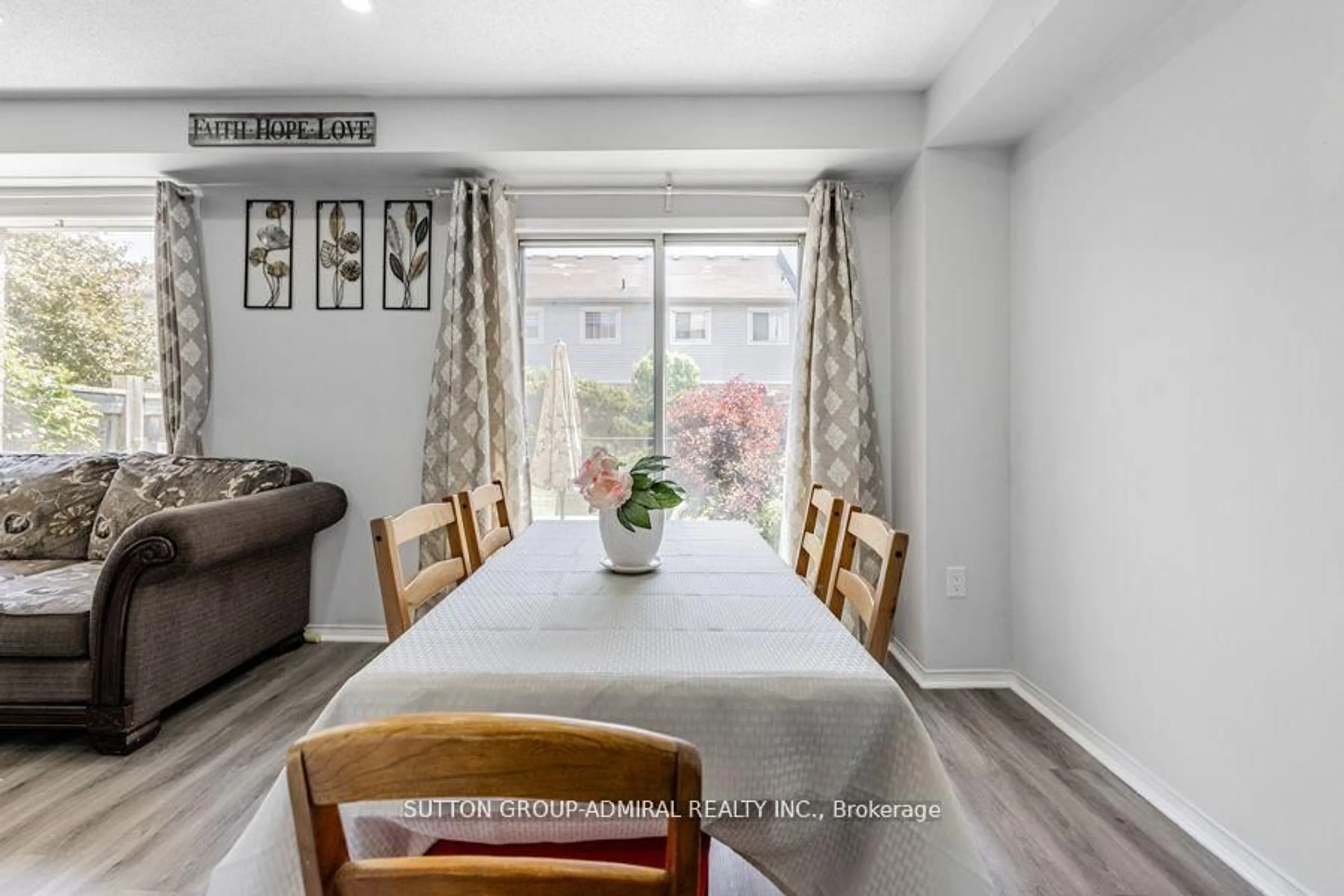Dining room, wood/laminate floor for 88 Wickstead Crt, Brampton Ontario L6R 1N8