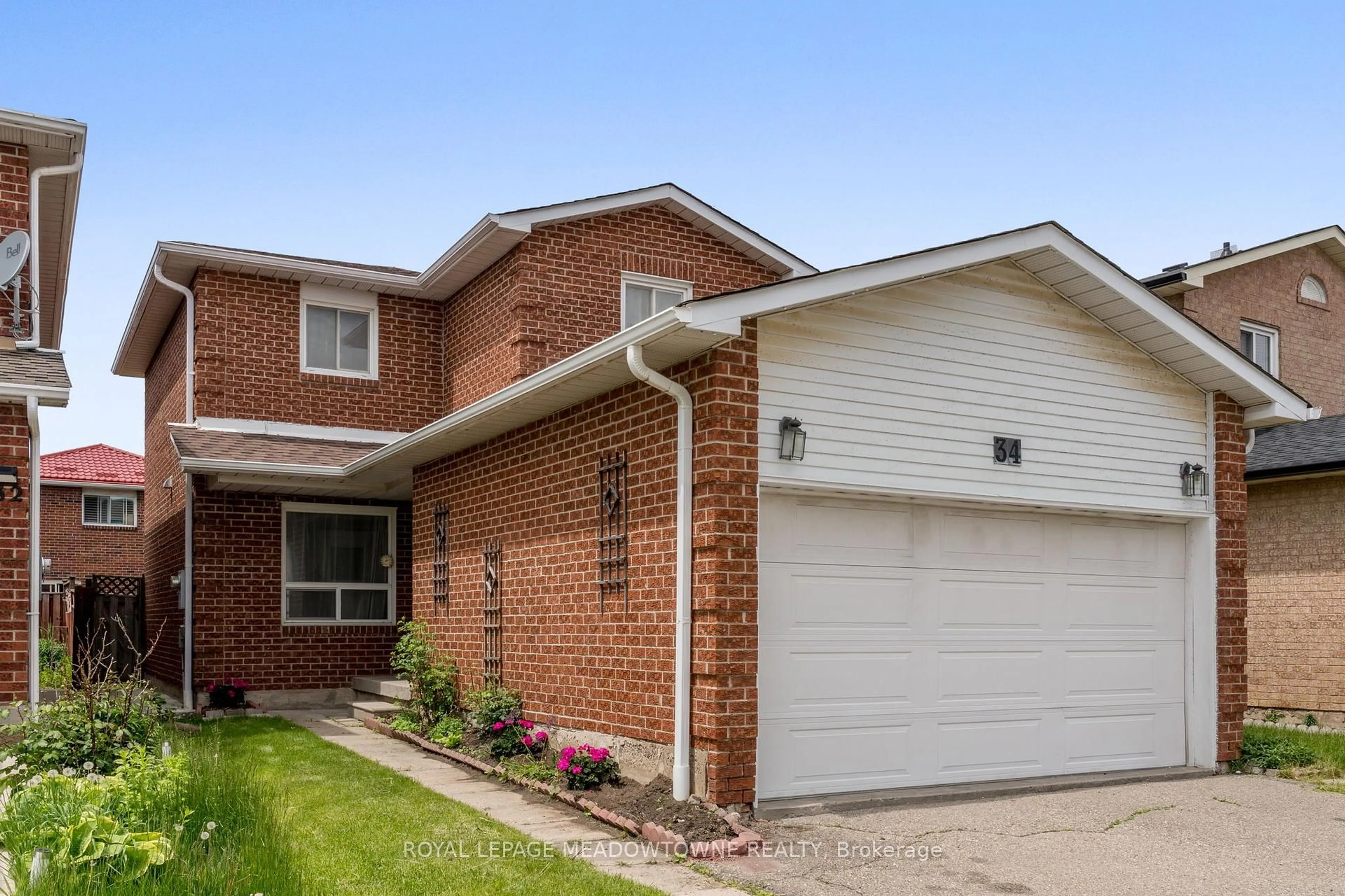 Home with brick exterior material, street for 34 Metzak Dr, Brampton Ontario L6Z 4N3