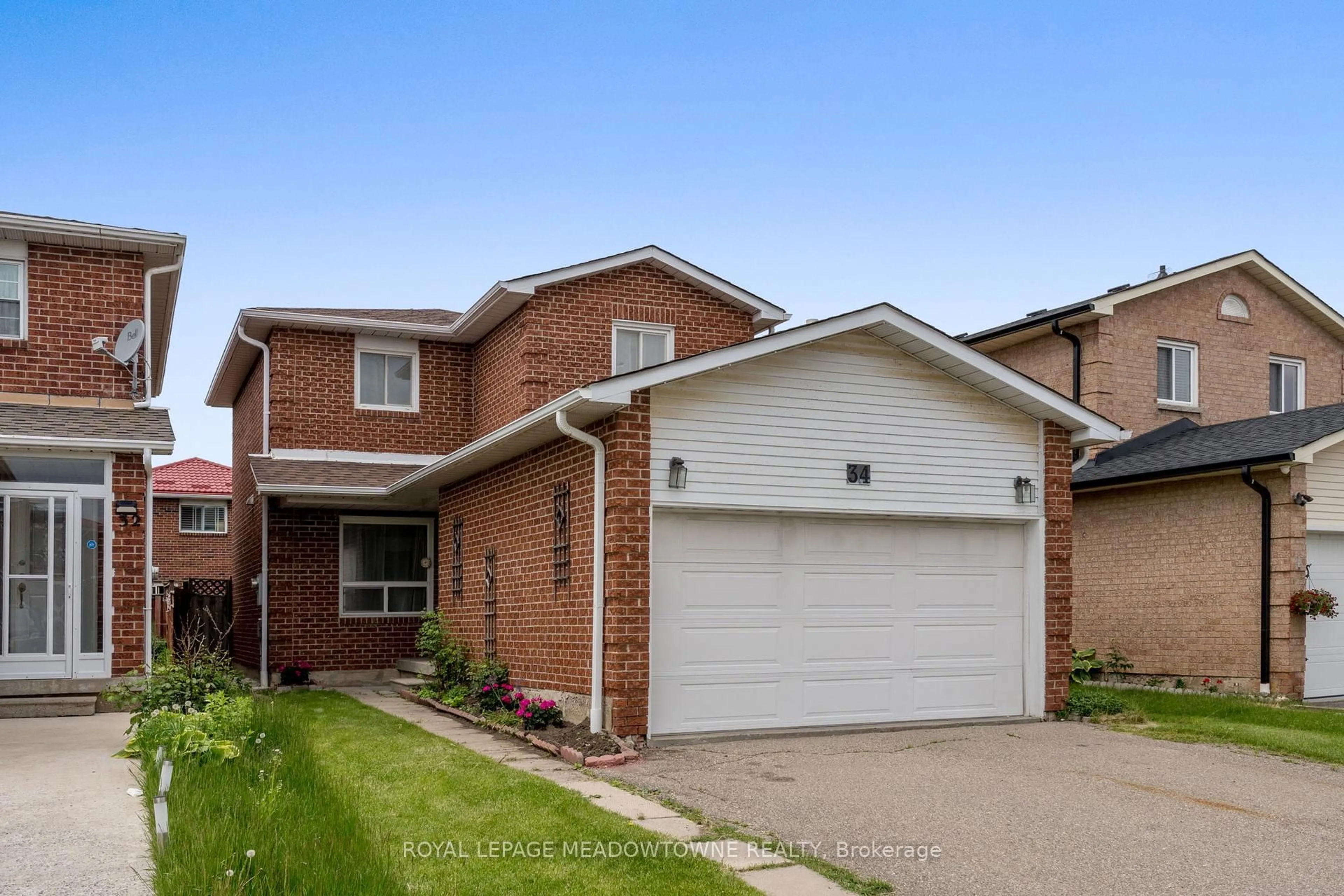 Home with brick exterior material, street for 34 Metzak Dr, Brampton Ontario L6Z 4N3