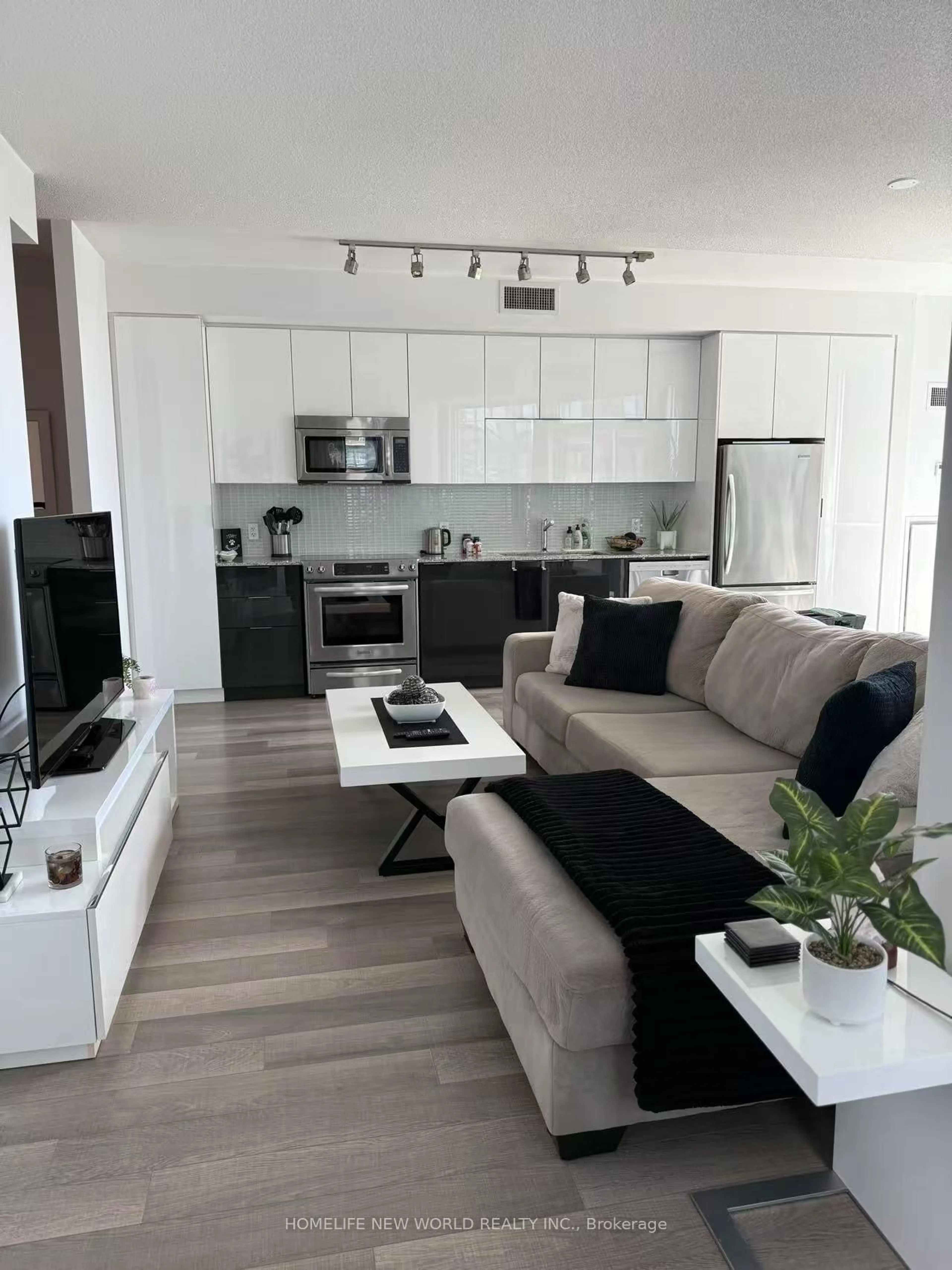 Living room with furniture, wood/laminate floor for 80 Marine Parade Dr #806, Toronto Ontario M8V 0A3