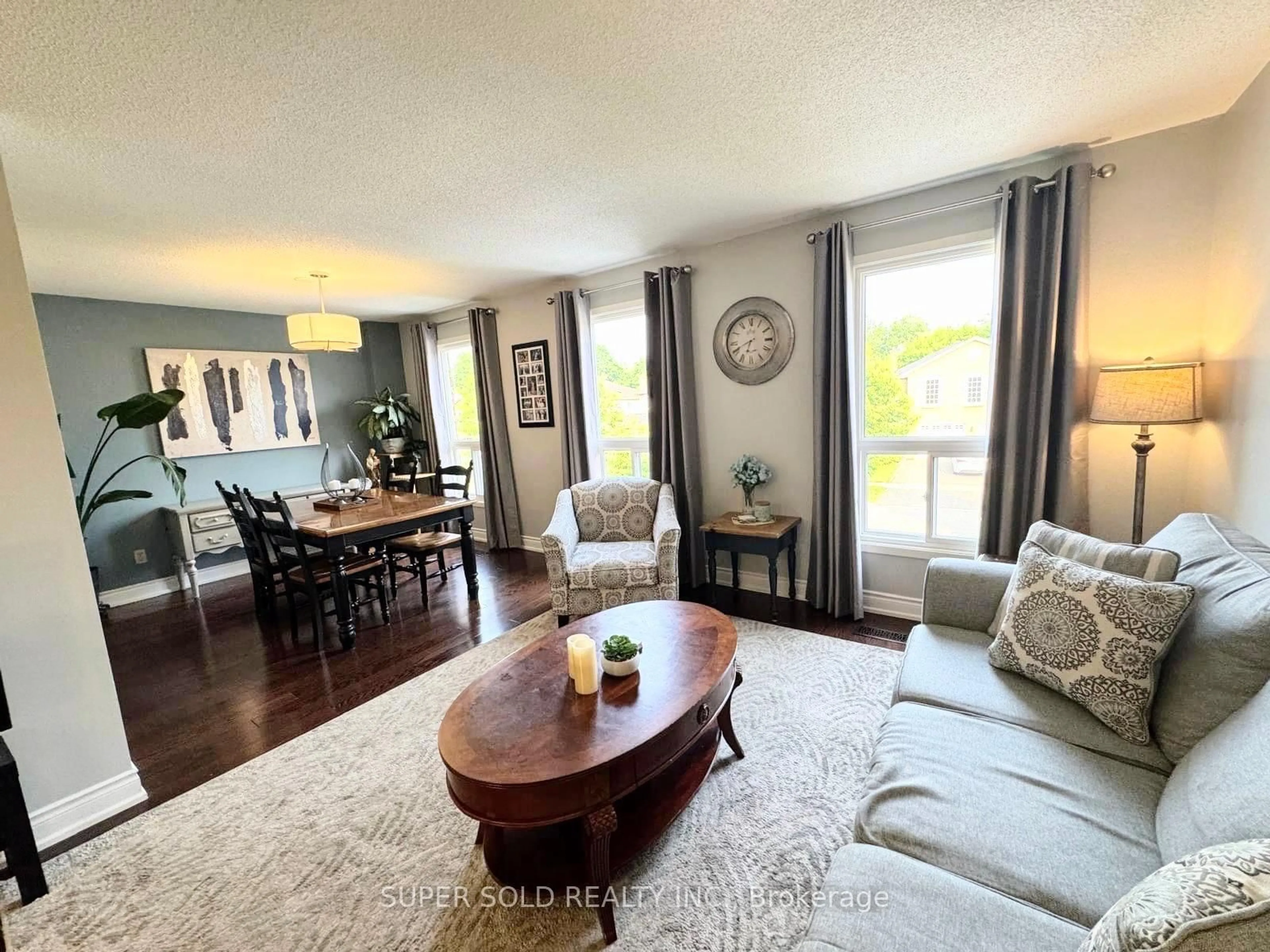 Living room with furniture, wood/laminate floor for 25 Floribunda Cres, Brampton Ontario L6T 4R8