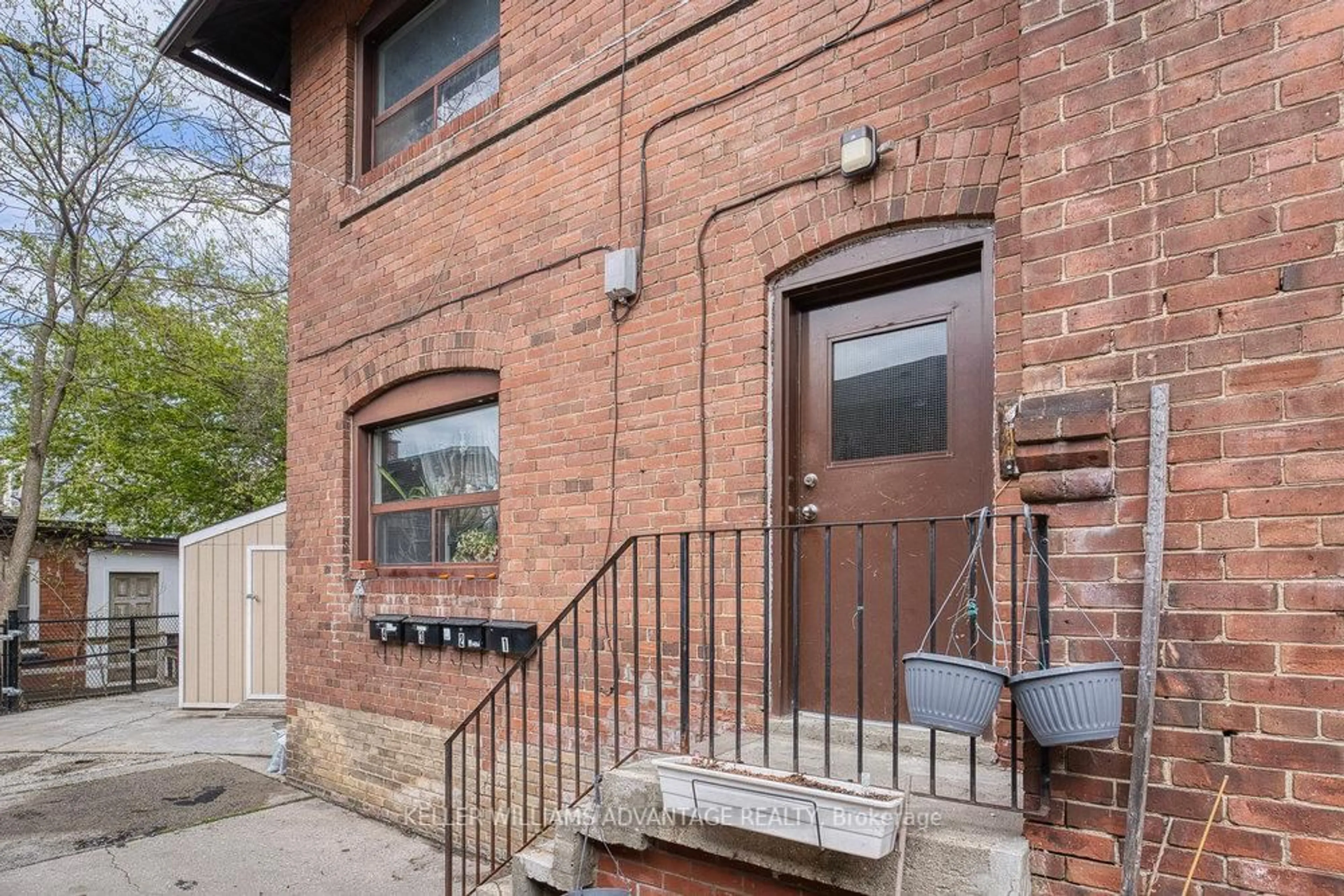Home with brick exterior material, street for 24 Indian Road Cres, Toronto Ontario M6P 2G1