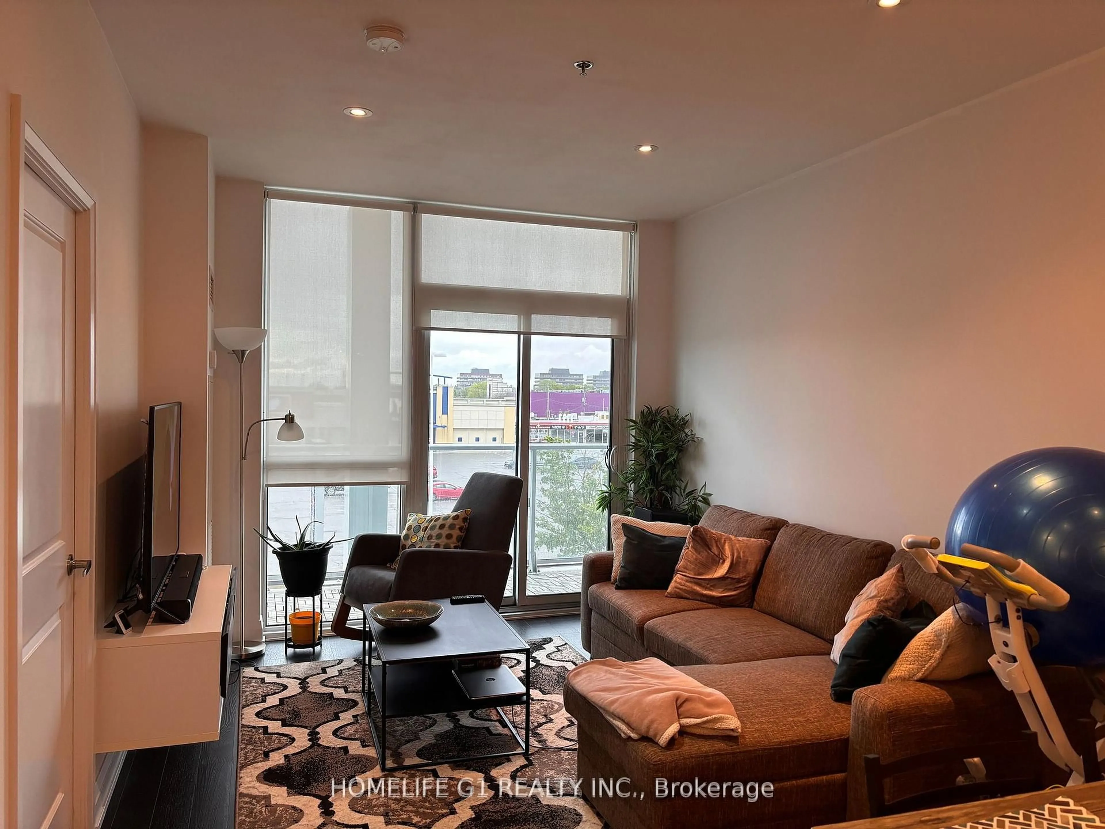 Living room with furniture, unknown for 65 Speers Rd #318, Oakville Ontario L6K 2E6