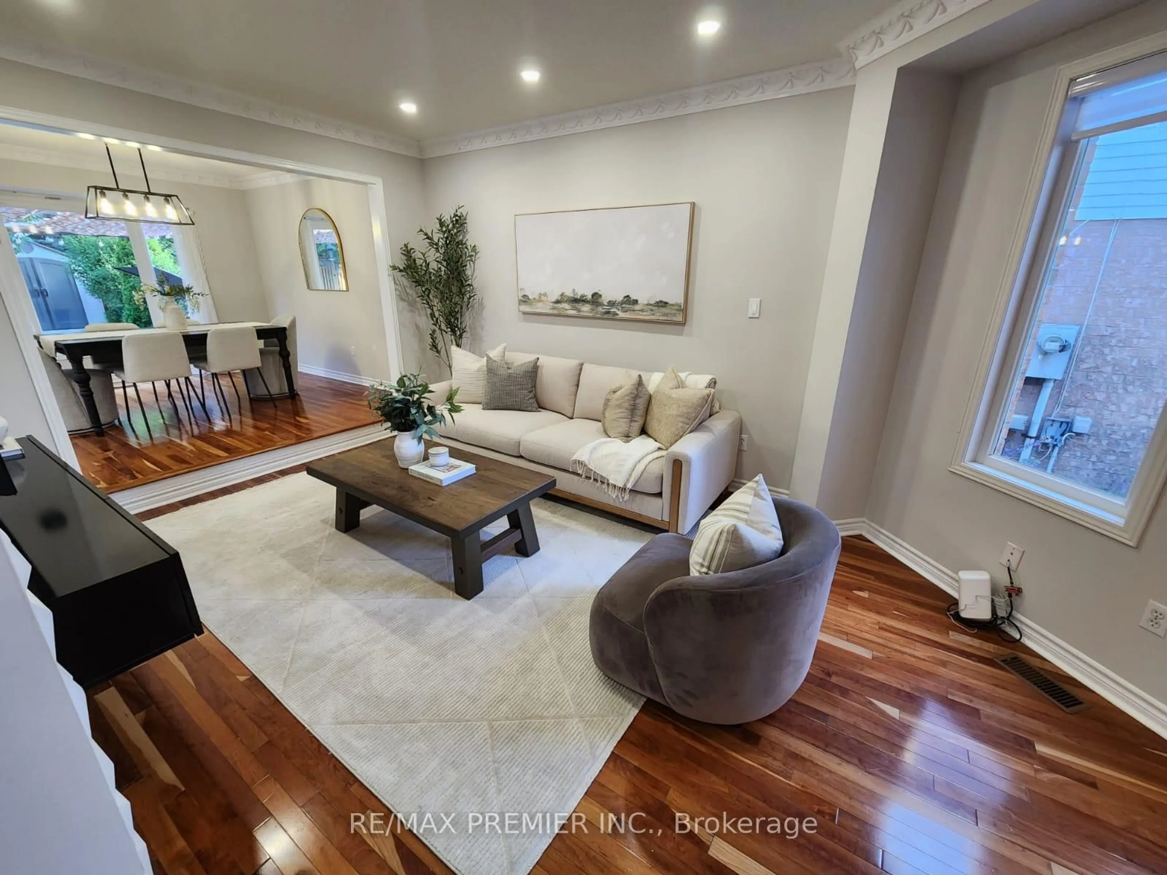 Living room with furniture, wood/laminate floor for 3480 Ingram Rd, Mississauga Ontario L5L 4M7