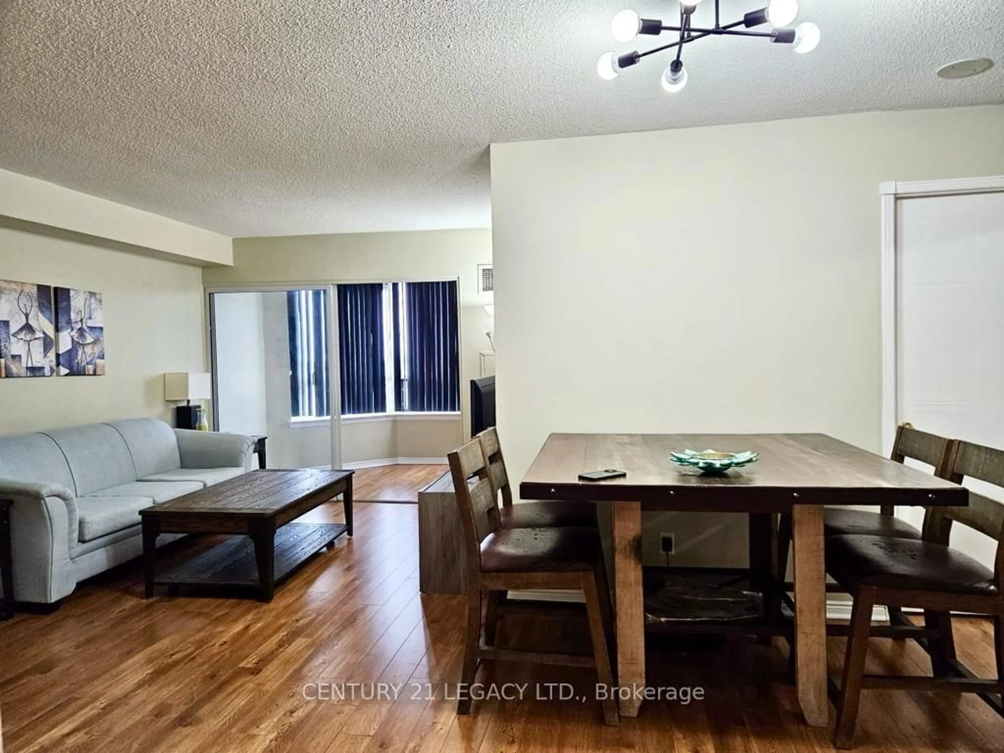 Living room with furniture, wood/laminate floor for 135 Hillcrest Ave #1910, Mississauga Ontario L5B 4B1