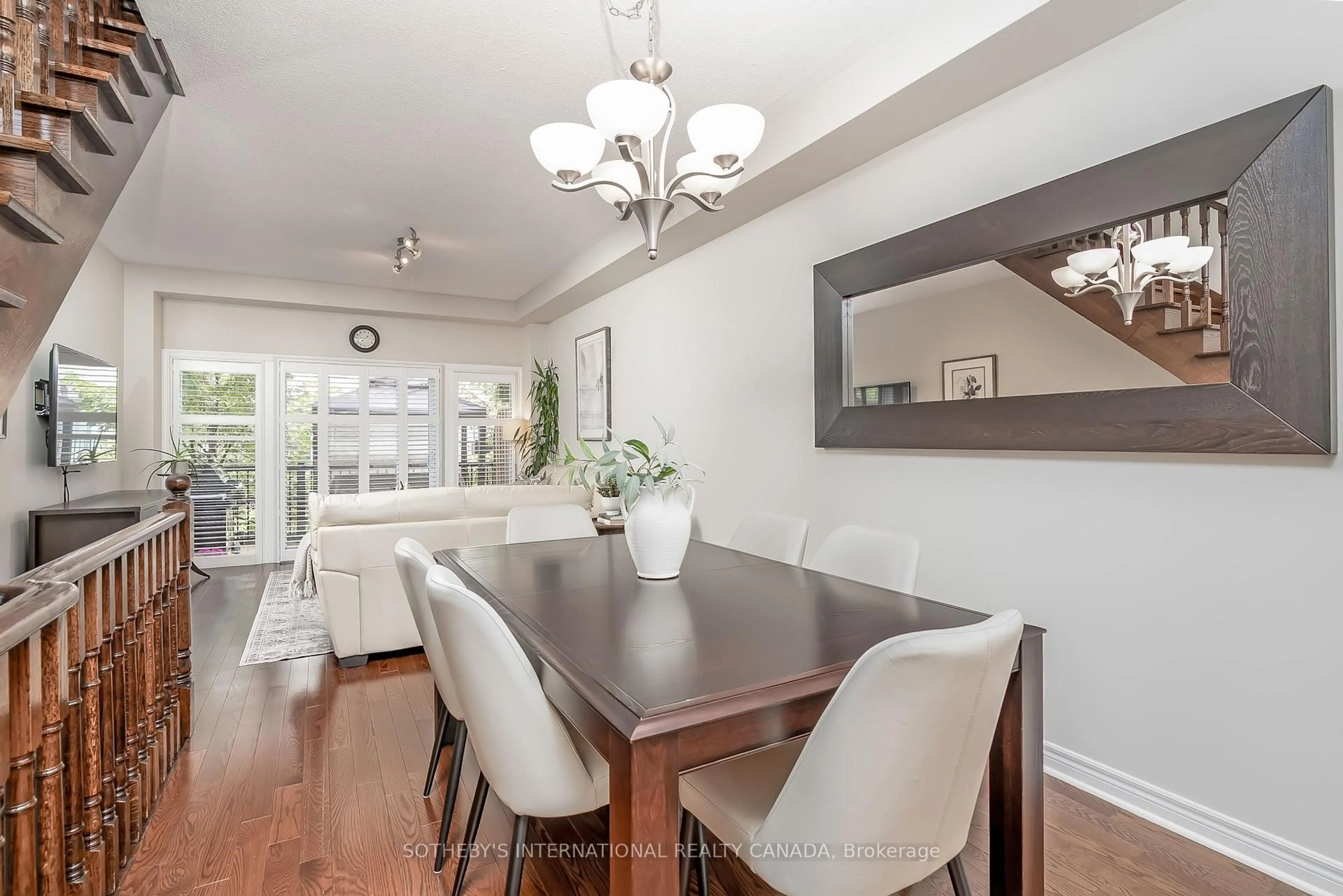 Dining room, wood/laminate floor for 16 Market Garden Mews, Toronto Ontario M8Z 0A5