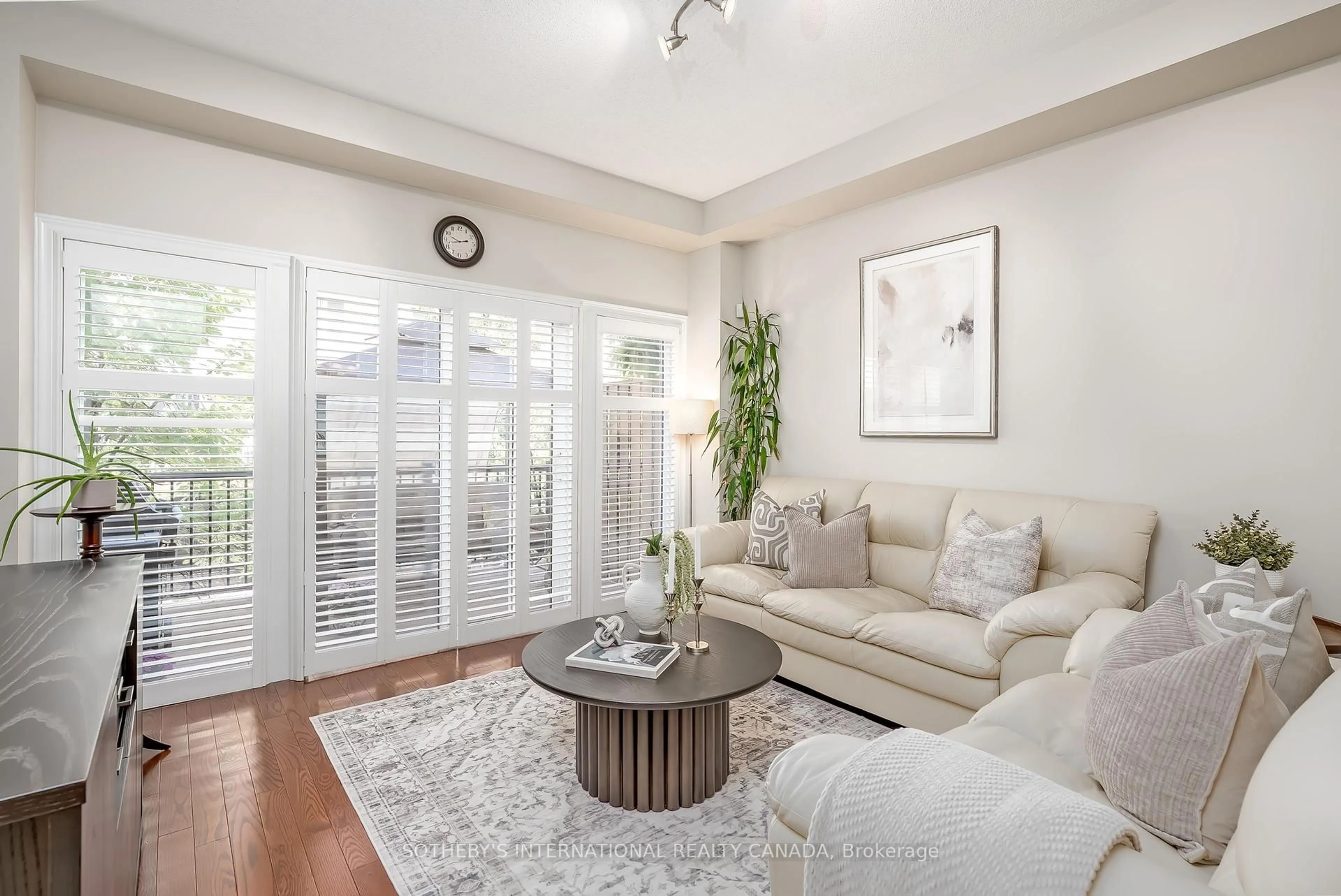 Living room with furniture, unknown for 16 Market Garden Mews, Toronto Ontario M8Z 0A5