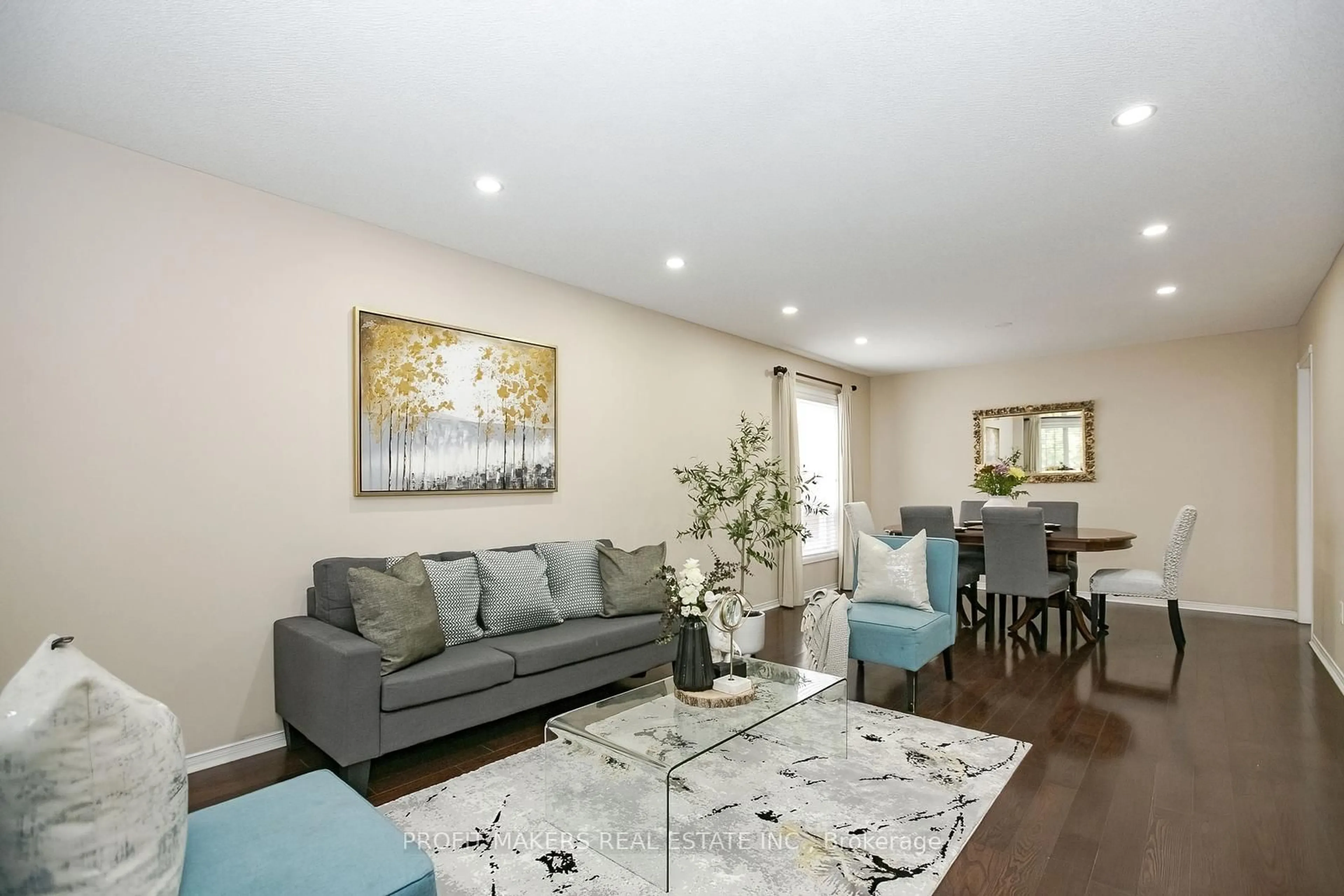 Living room with furniture, wood/laminate floor for 66 Dwellers Rd, Brampton Ontario L6X 5B9