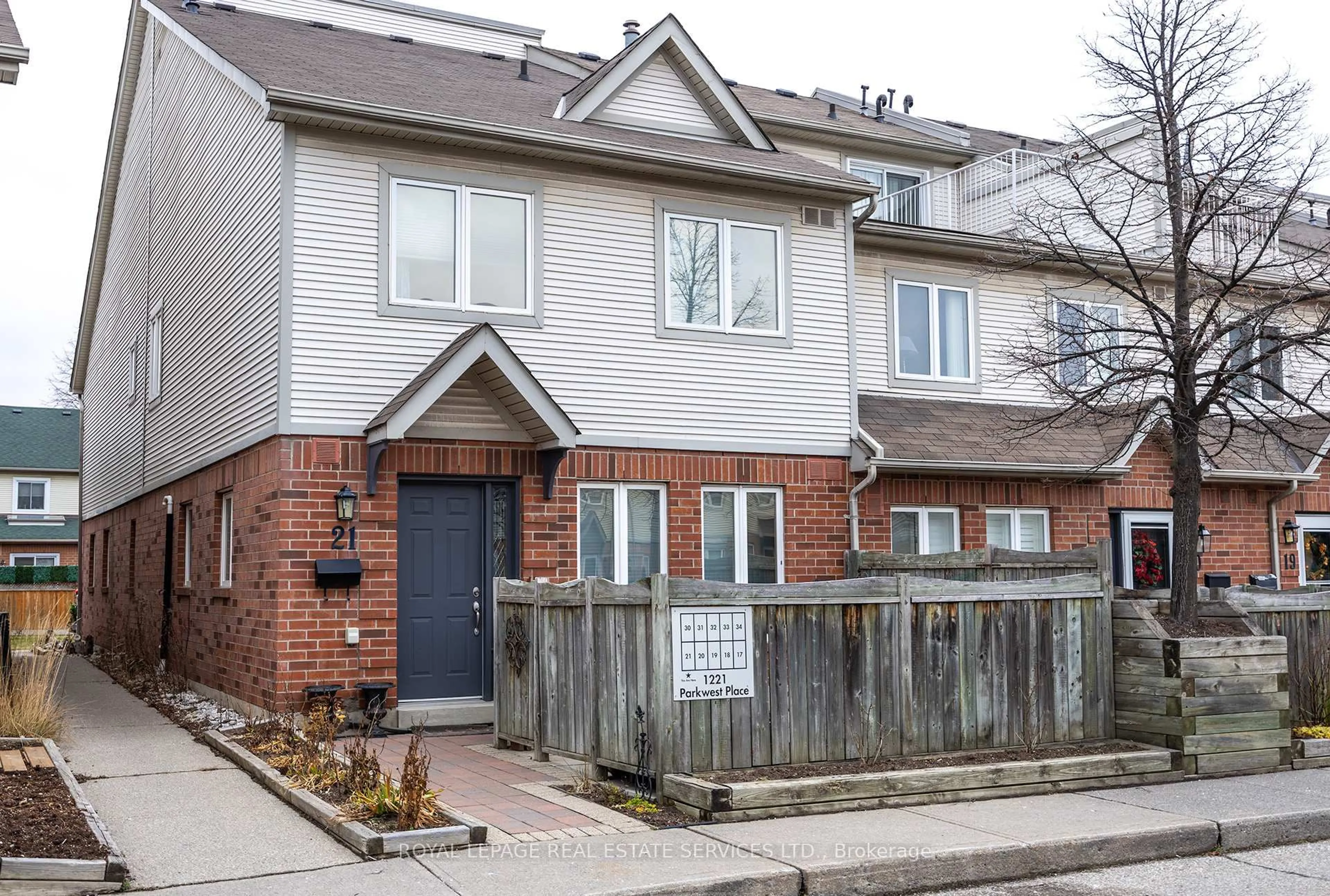 Home with brick exterior material, street for 1221 Parkwest Pl #21, Mississauga Ontario L5E 3J3
