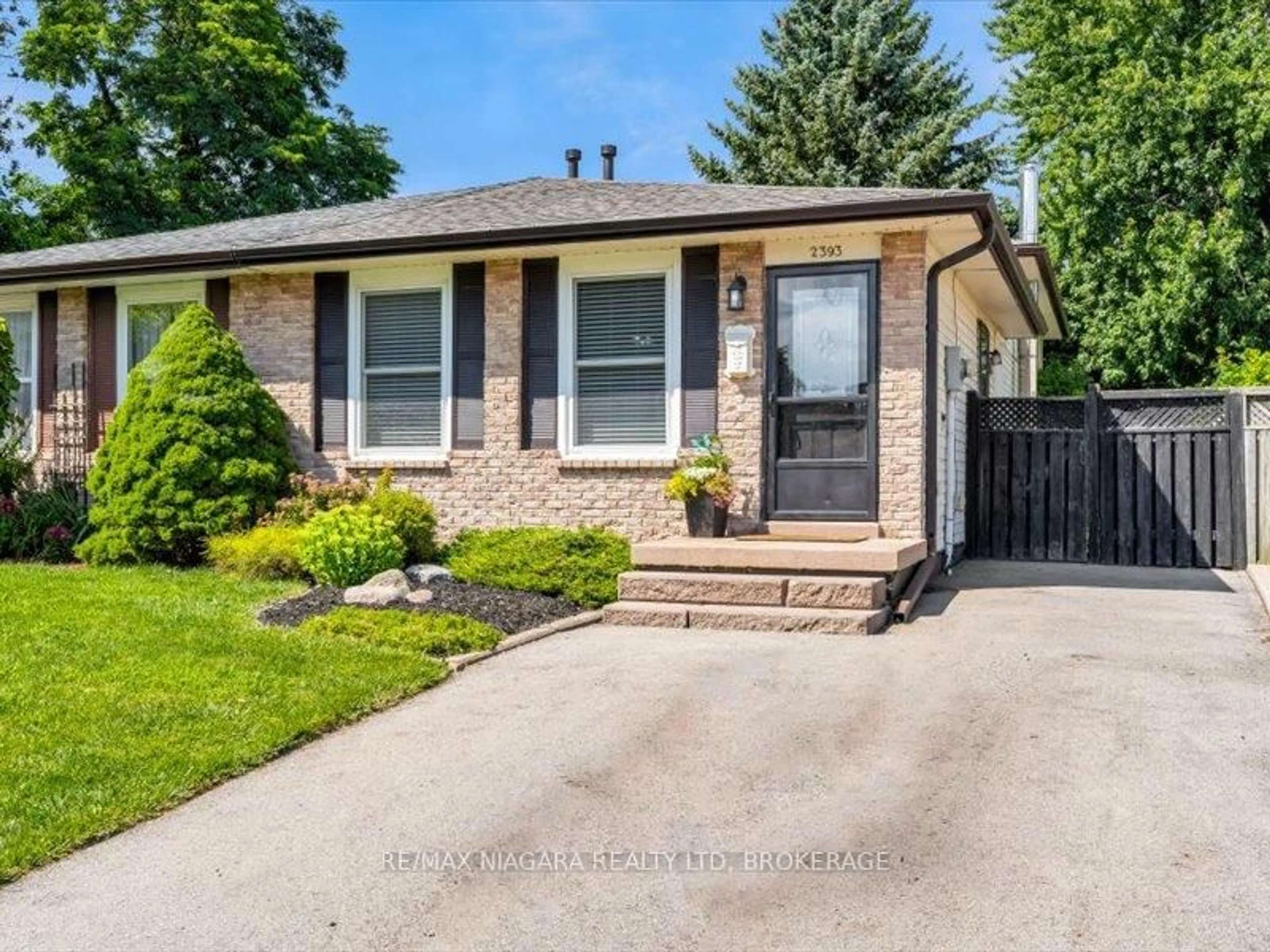 Home with brick exterior material, street for 2393 Greenbank Tr, Burlington Ontario L7P 3S7