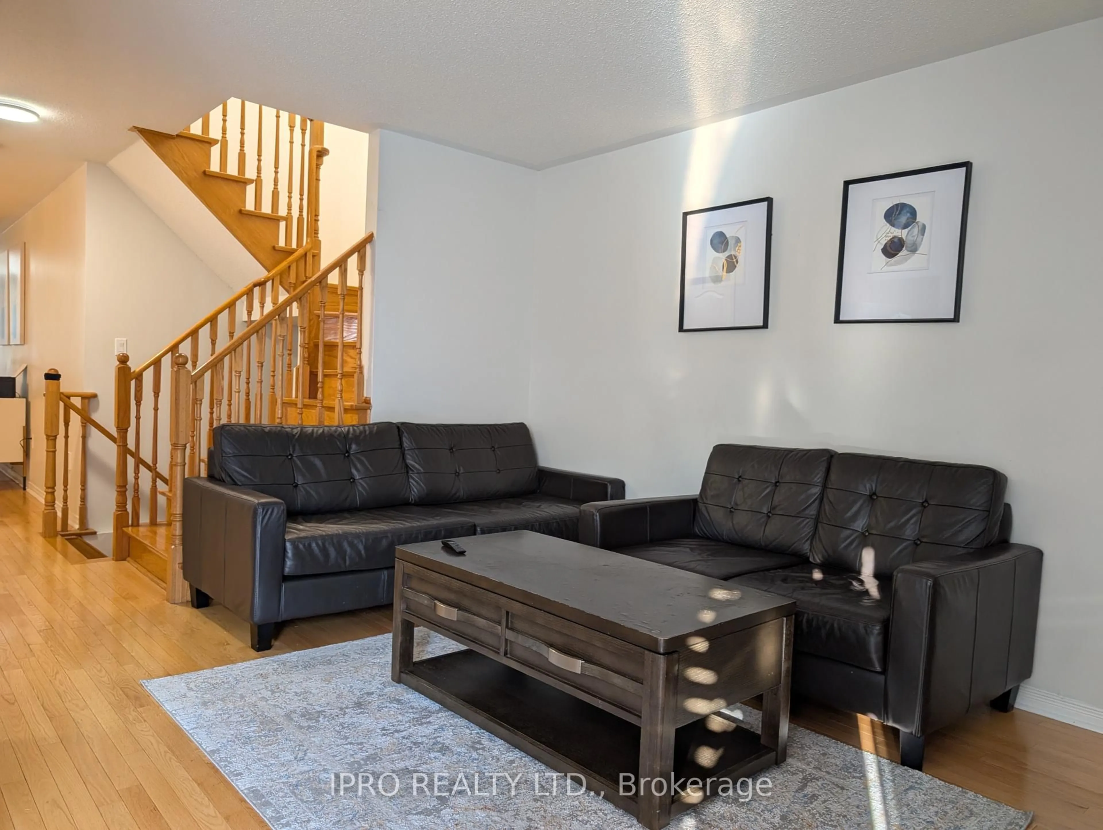 Living room with furniture, wood/laminate floor for 10 Polar Bear Pl, Brampton Ontario L6R 3L7