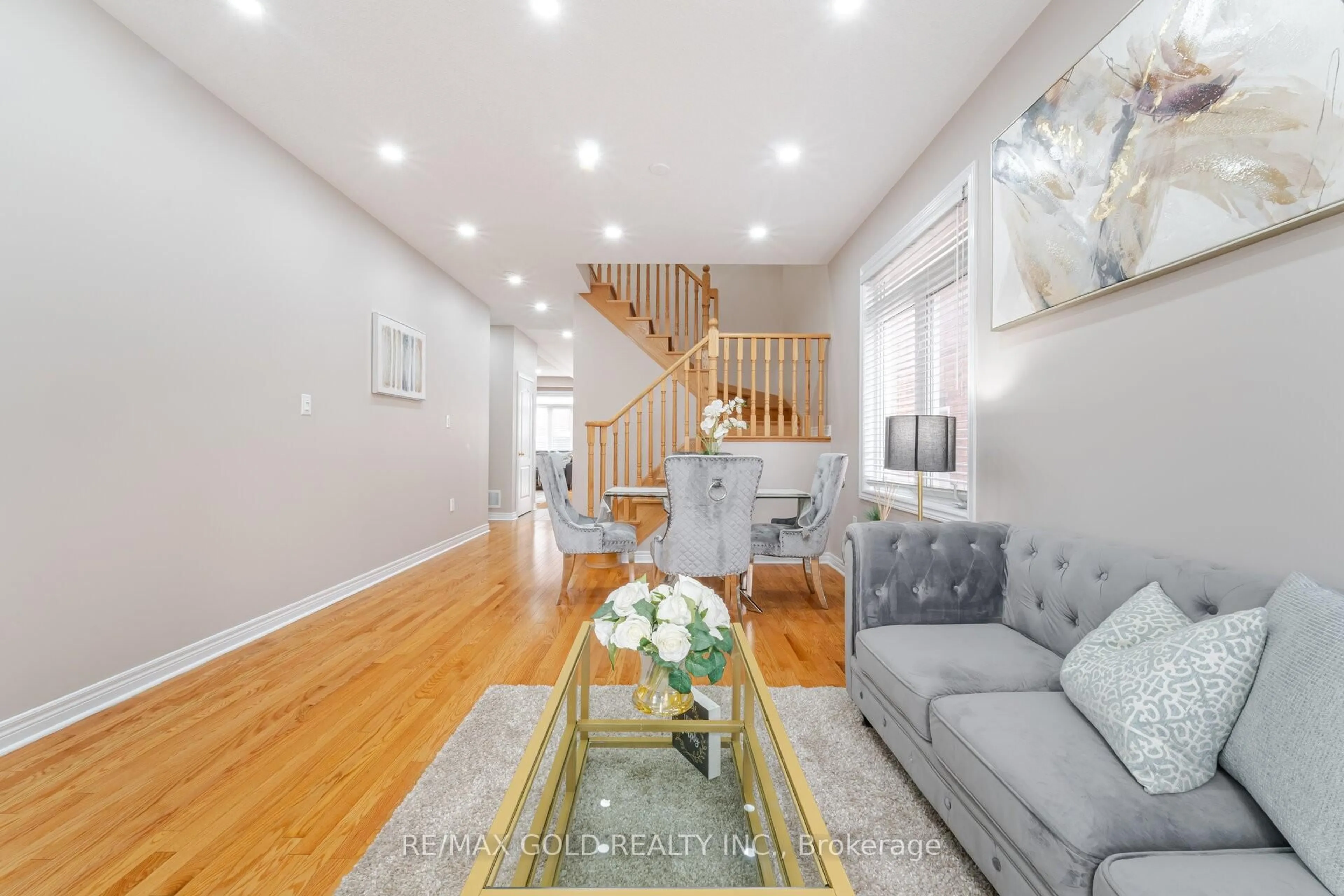 Living room with furniture, wood/laminate floor for 42 Literacy Dr, Brampton Ontario L6P 3G3