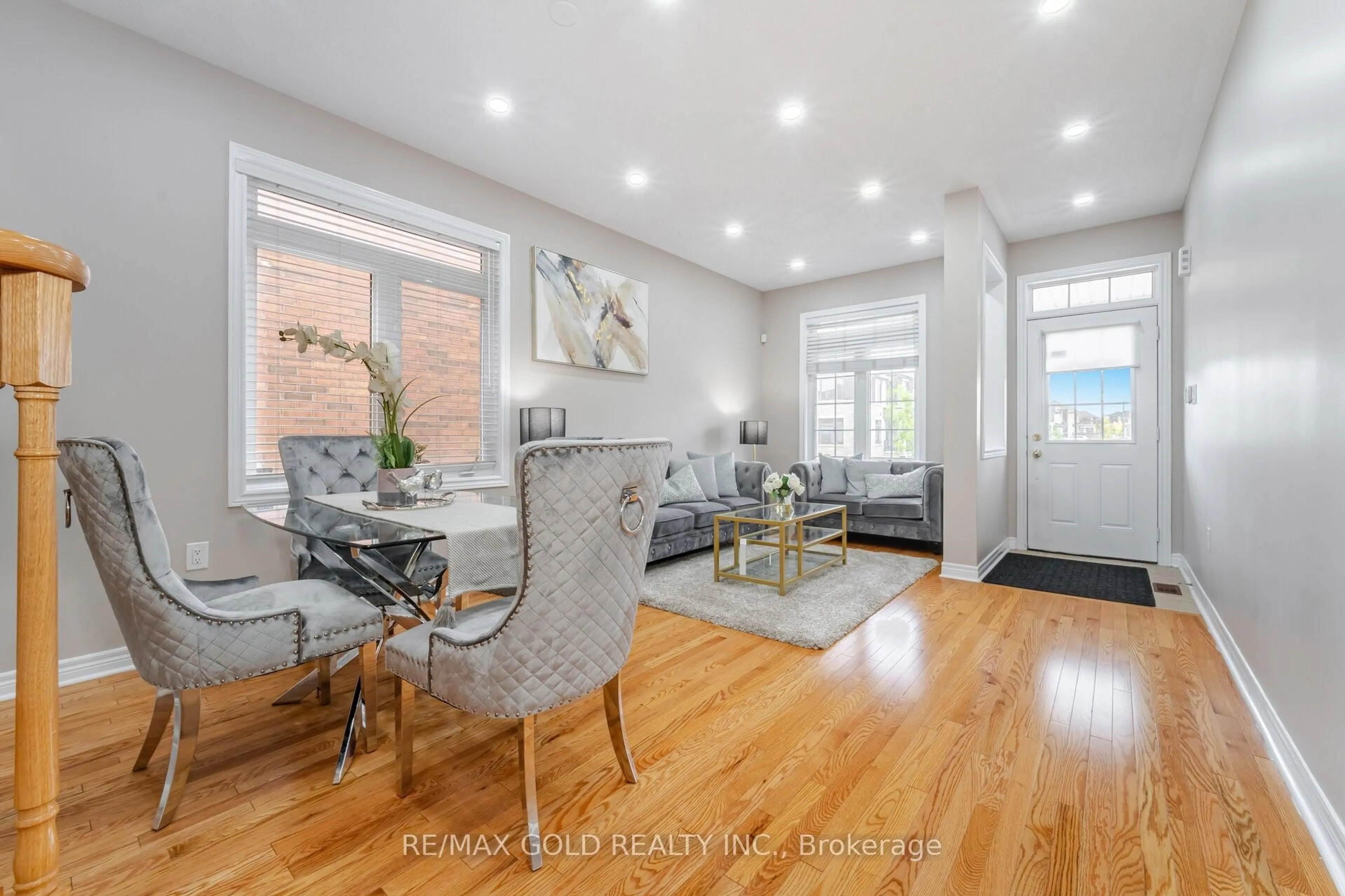 Living room with furniture, wood/laminate floor for 42 Literacy Dr, Brampton Ontario L6P 3G3