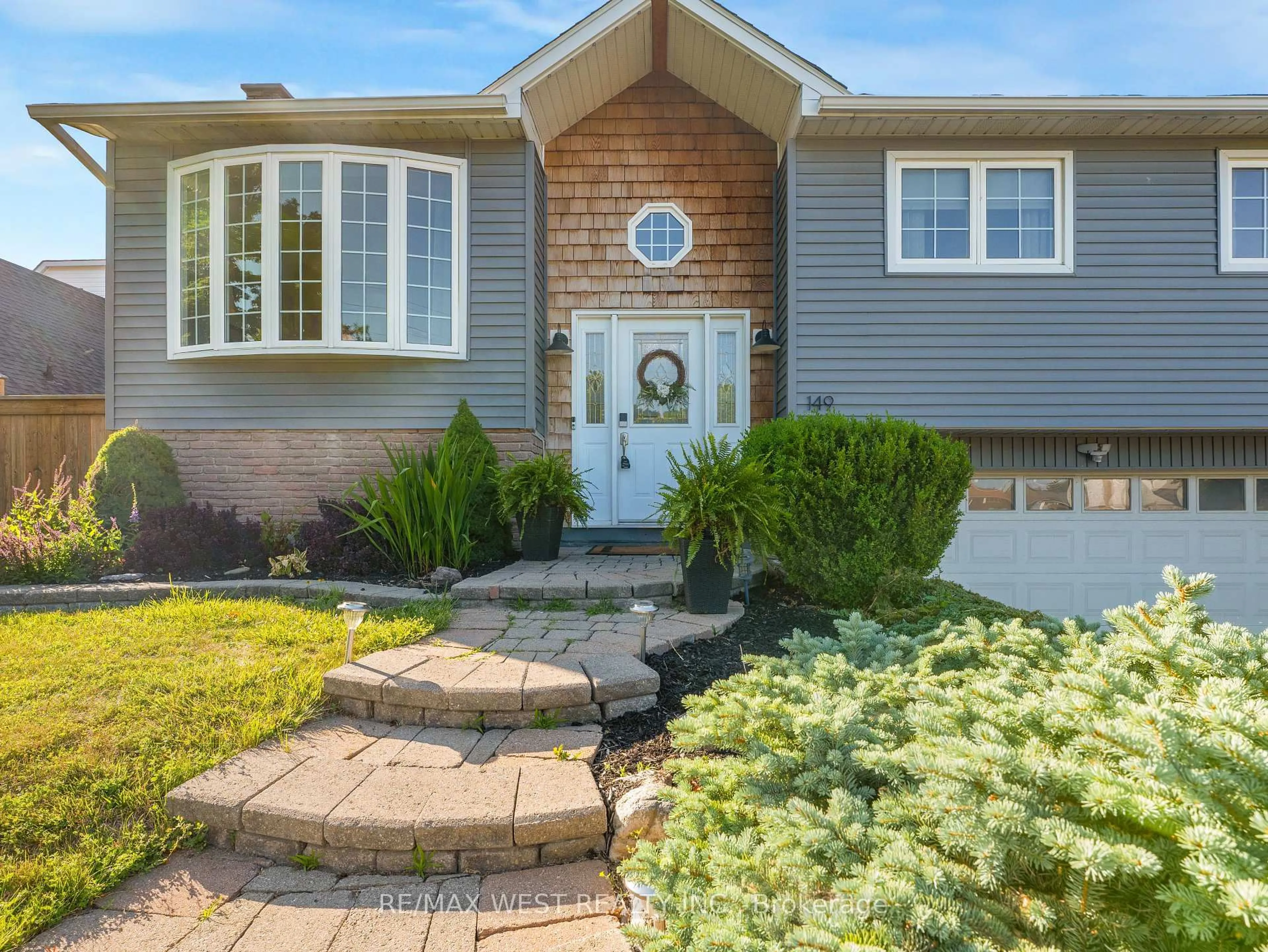 Home with vinyl exterior material, street for 149 Ellwood Dr, Caledon Ontario L7E 4W5