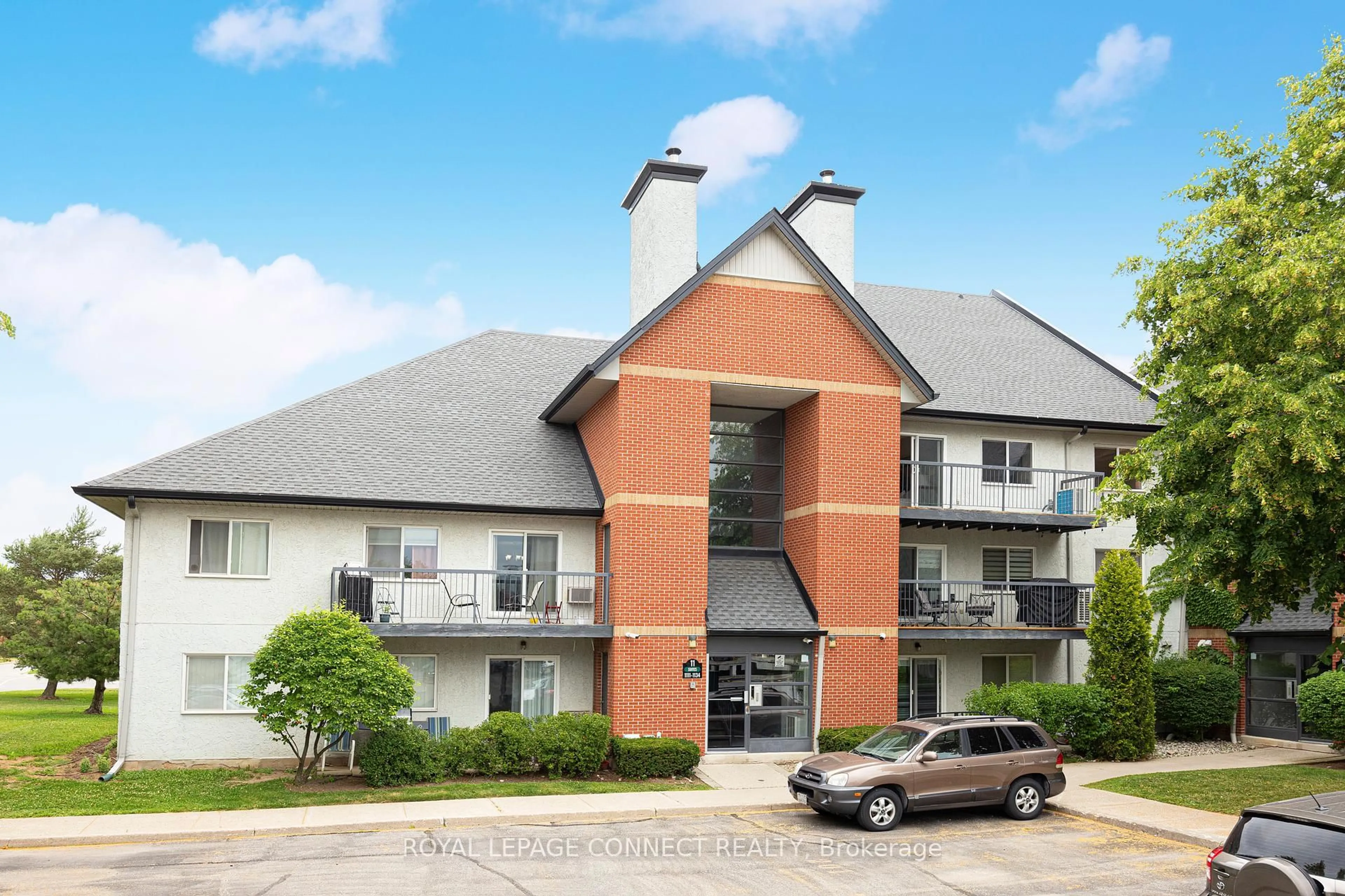 Home with brick exterior material, building for 1450 Glen Abbey Gate #1132, Oakville Ontario L6M 2V7