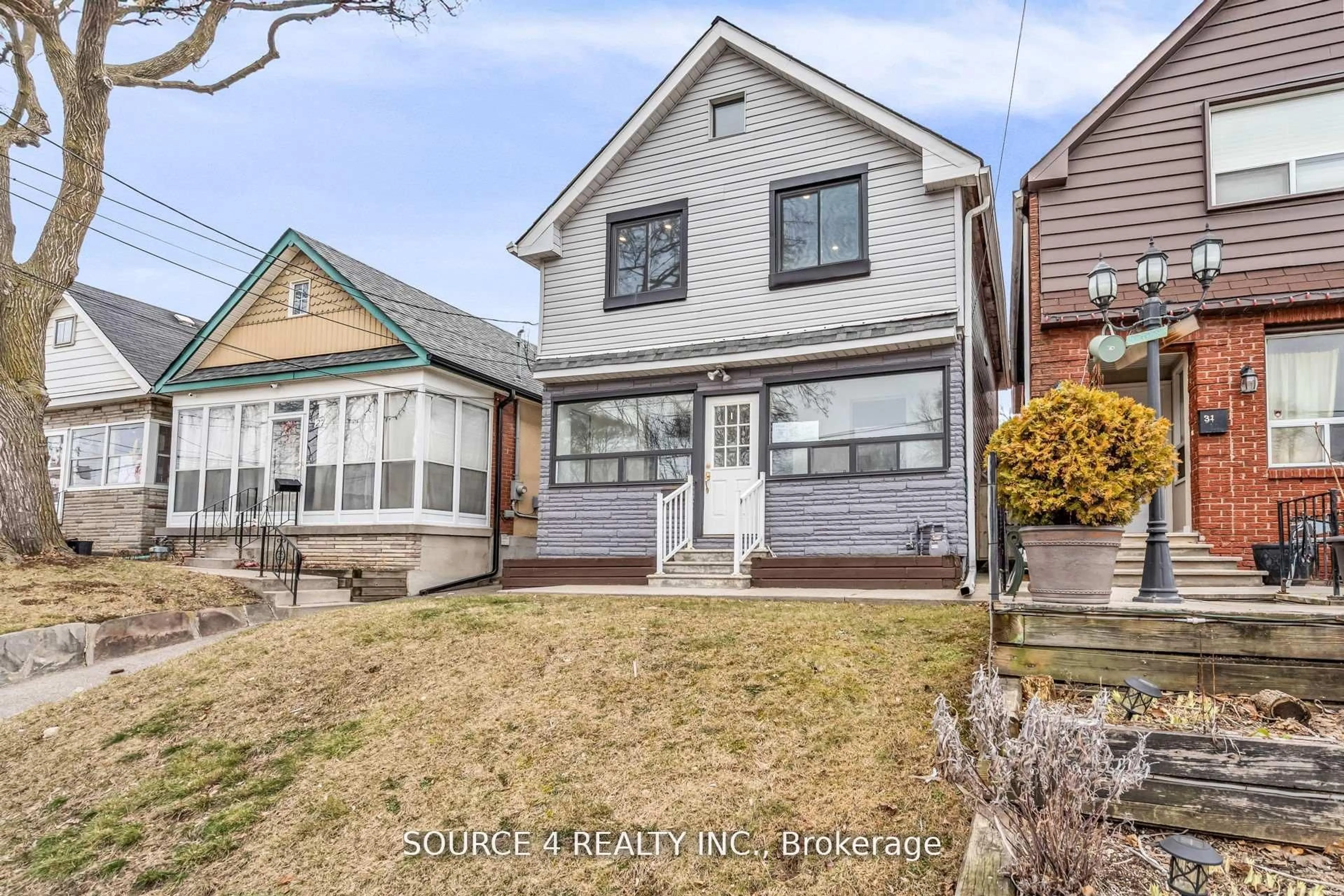 Home with vinyl exterior material, street for 29 Hillary Ave, Toronto Ontario M6N 2B9