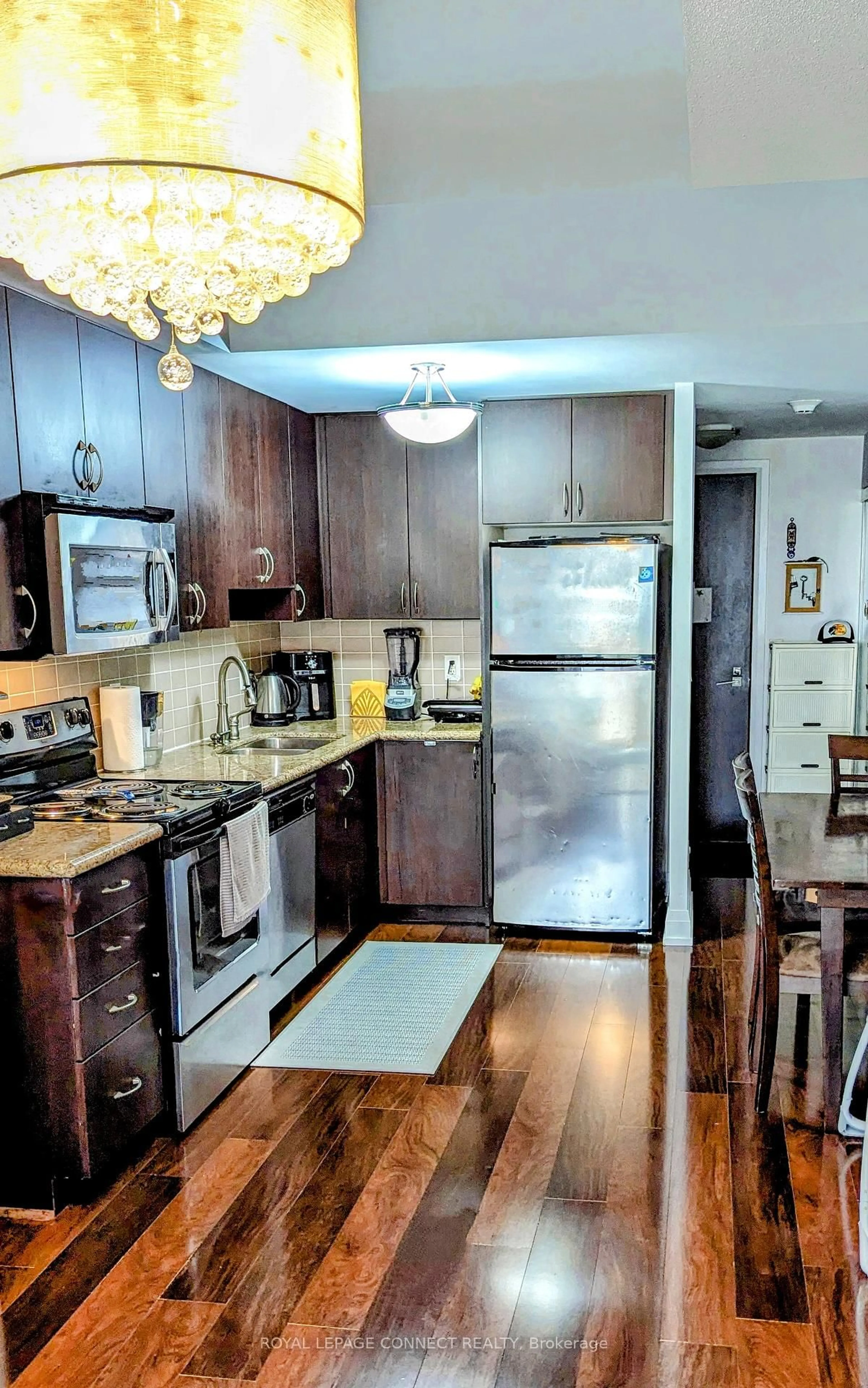 Open concept kitchen, wood/laminate floor for 1 De Boers Dr #1610, Toronto Ontario M3J 0G6