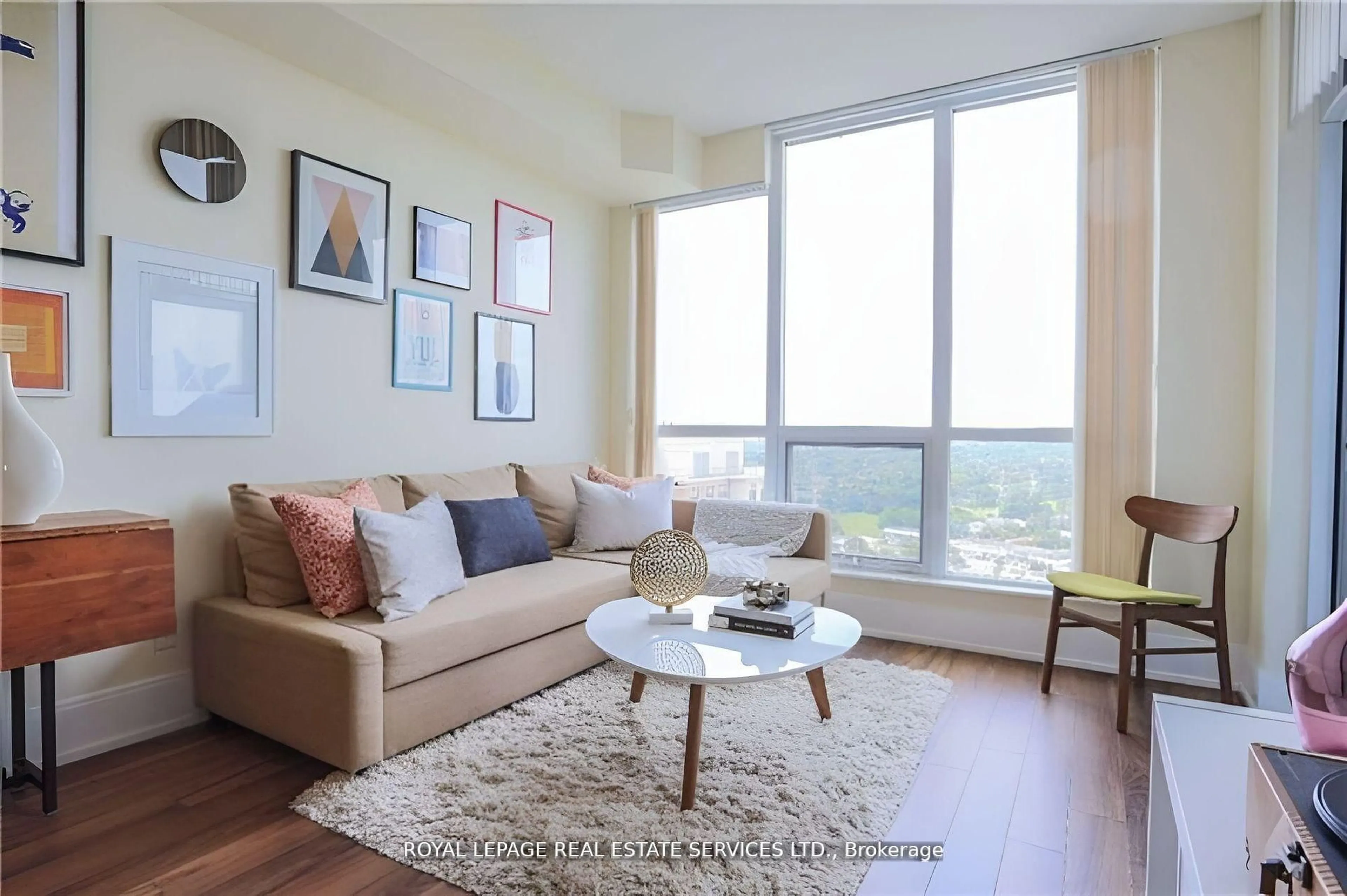 Living room with furniture, wood/laminate floor for 15 Viking Lane #2305, Toronto Ontario M9B 0A4