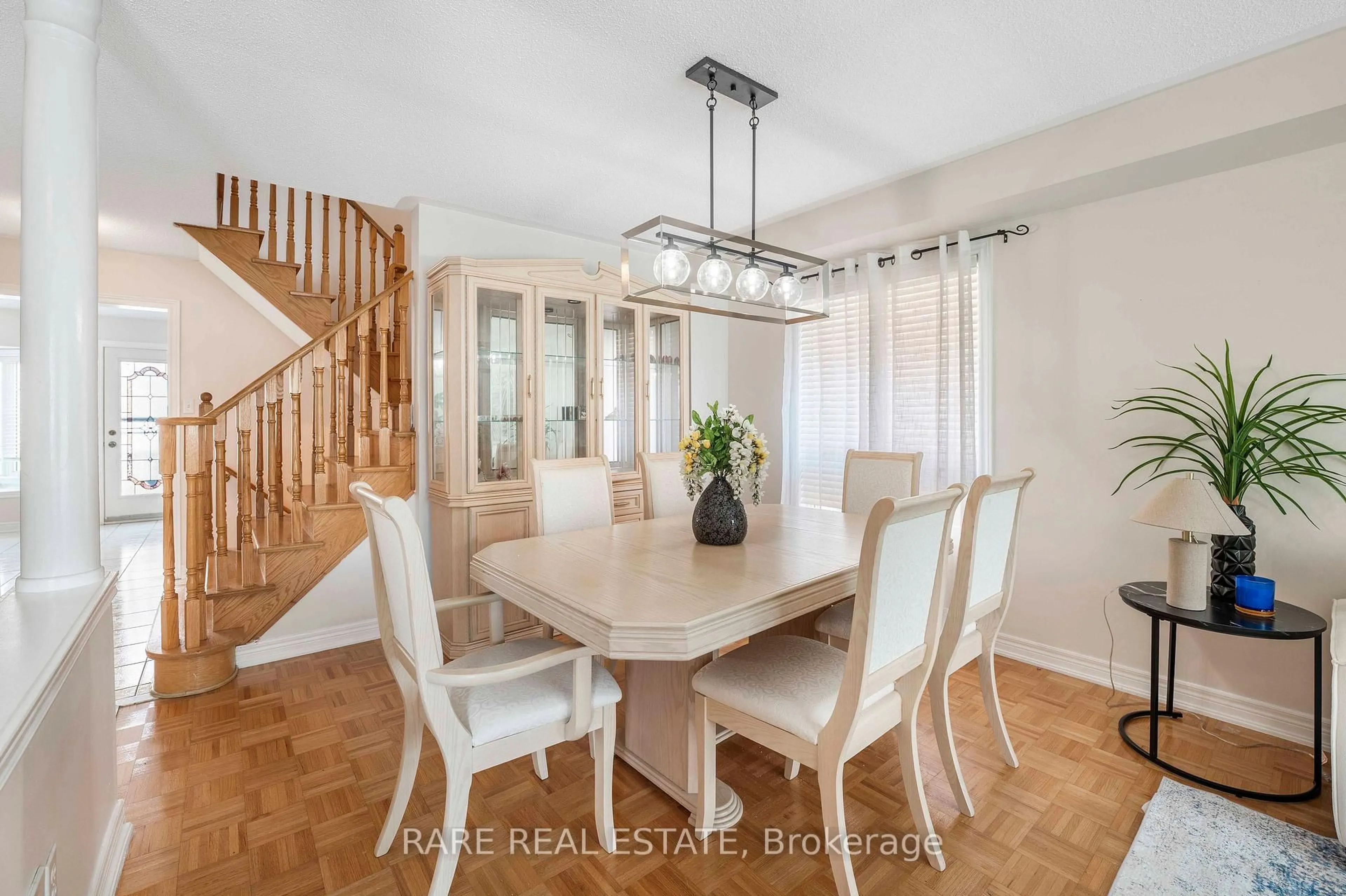 Dining room, wood/laminate floor for 51 Wild Indigo Cres, Brampton Ontario L6R 2J9