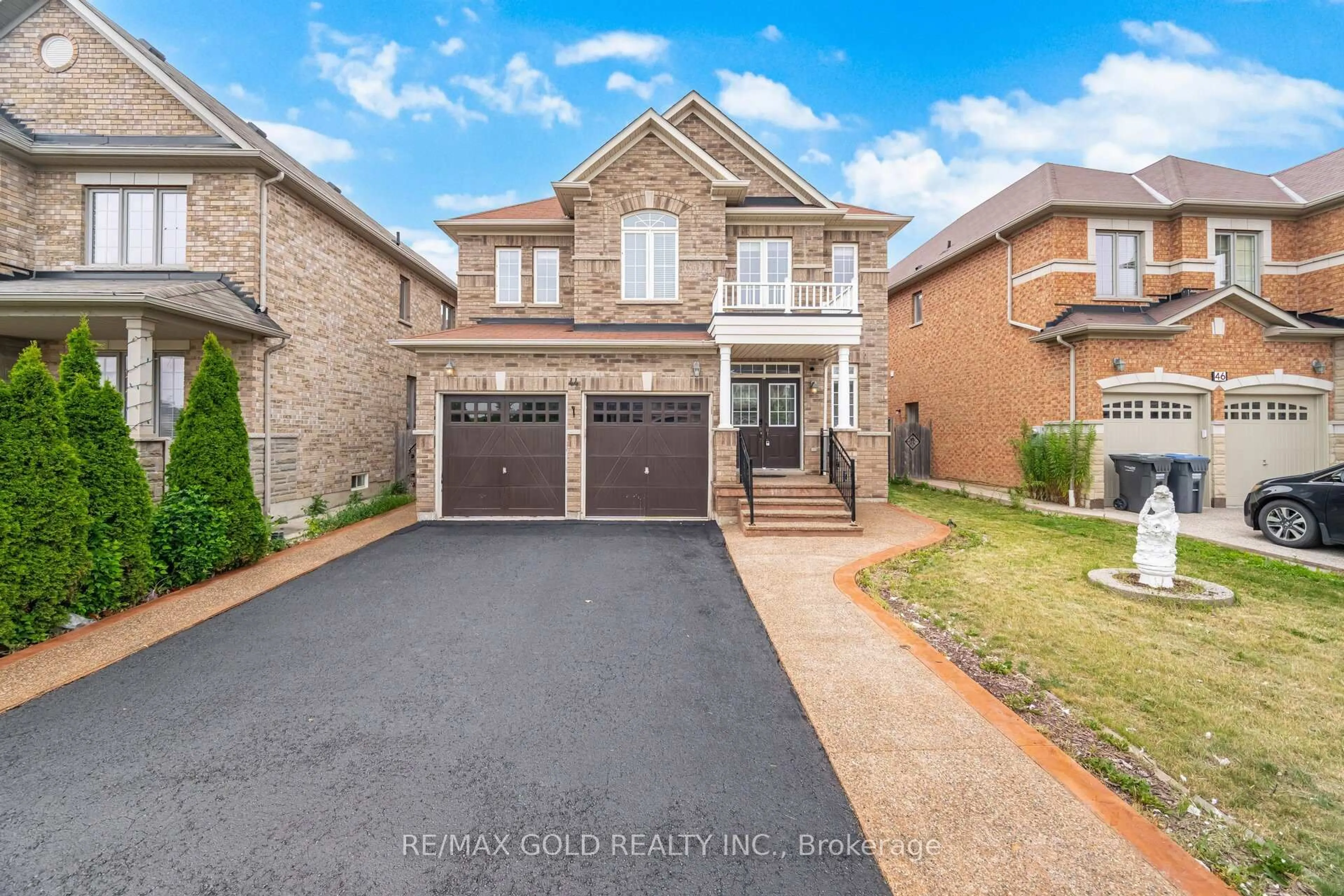 Home with brick exterior material, street for 44 Gardenbrooke Tr, Brampton Ontario L6P 3J3