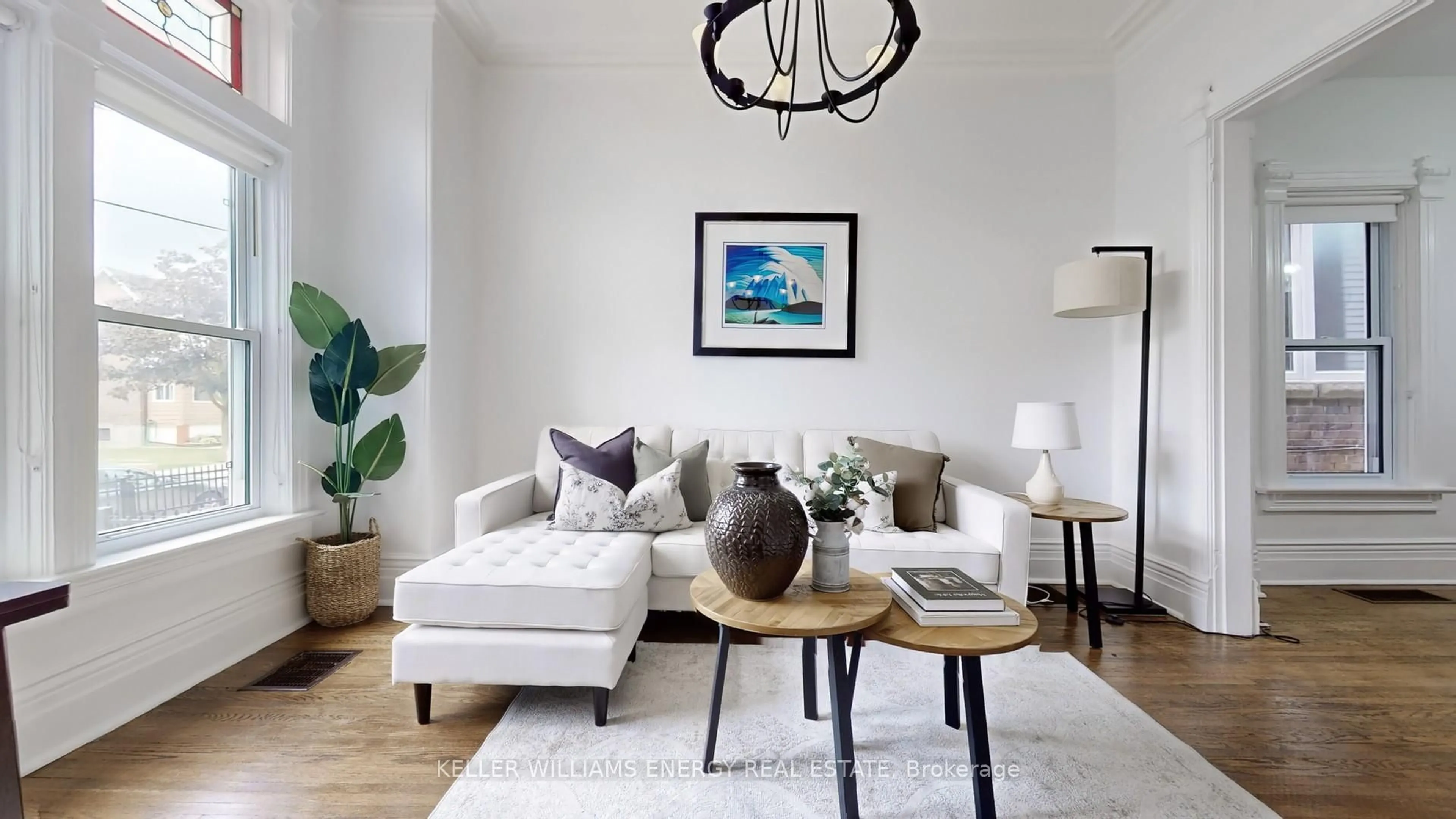 Living room with furniture, wood/laminate floor for 511 Perth Ave, Toronto Ontario M6N 2W6