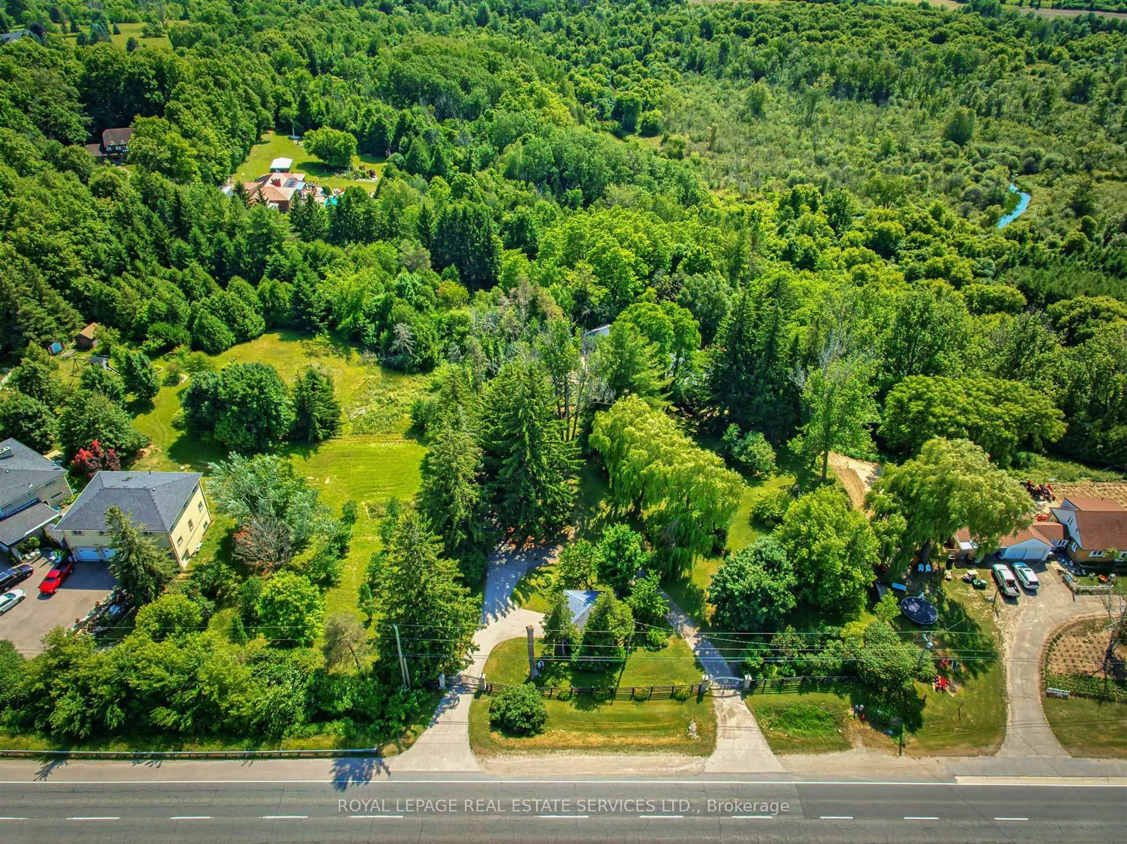 A pic from outside/outdoor area/front of a property/back of a property/a pic from drone, forest/trees view for 15624 Hurontario St, Caledon Ontario L7C 2C4