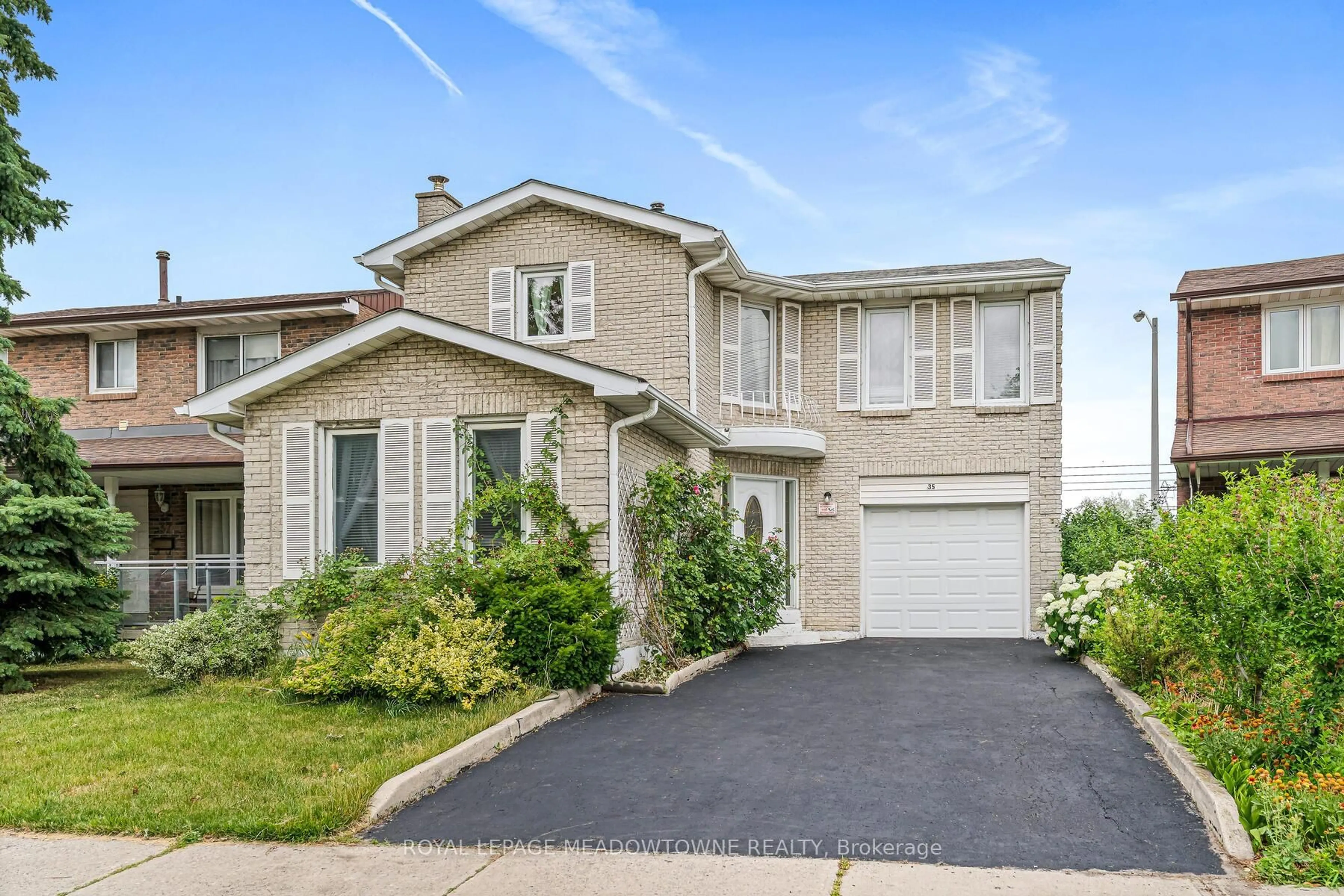 Home with brick exterior material, street for 35 Countryman Circ, Toronto Ontario M9V 4M8