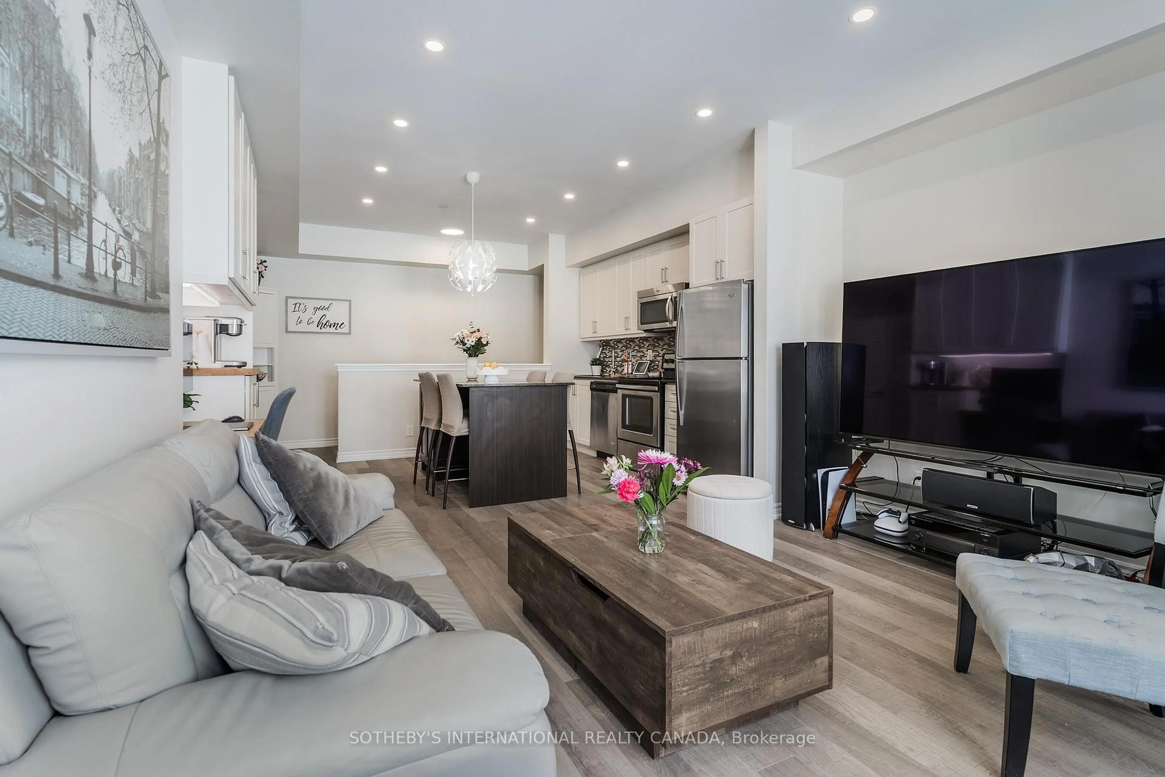 Living room with furniture, wood/laminate floor for 50 Carnation Ave #148, Toronto Ontario M8V 0B8