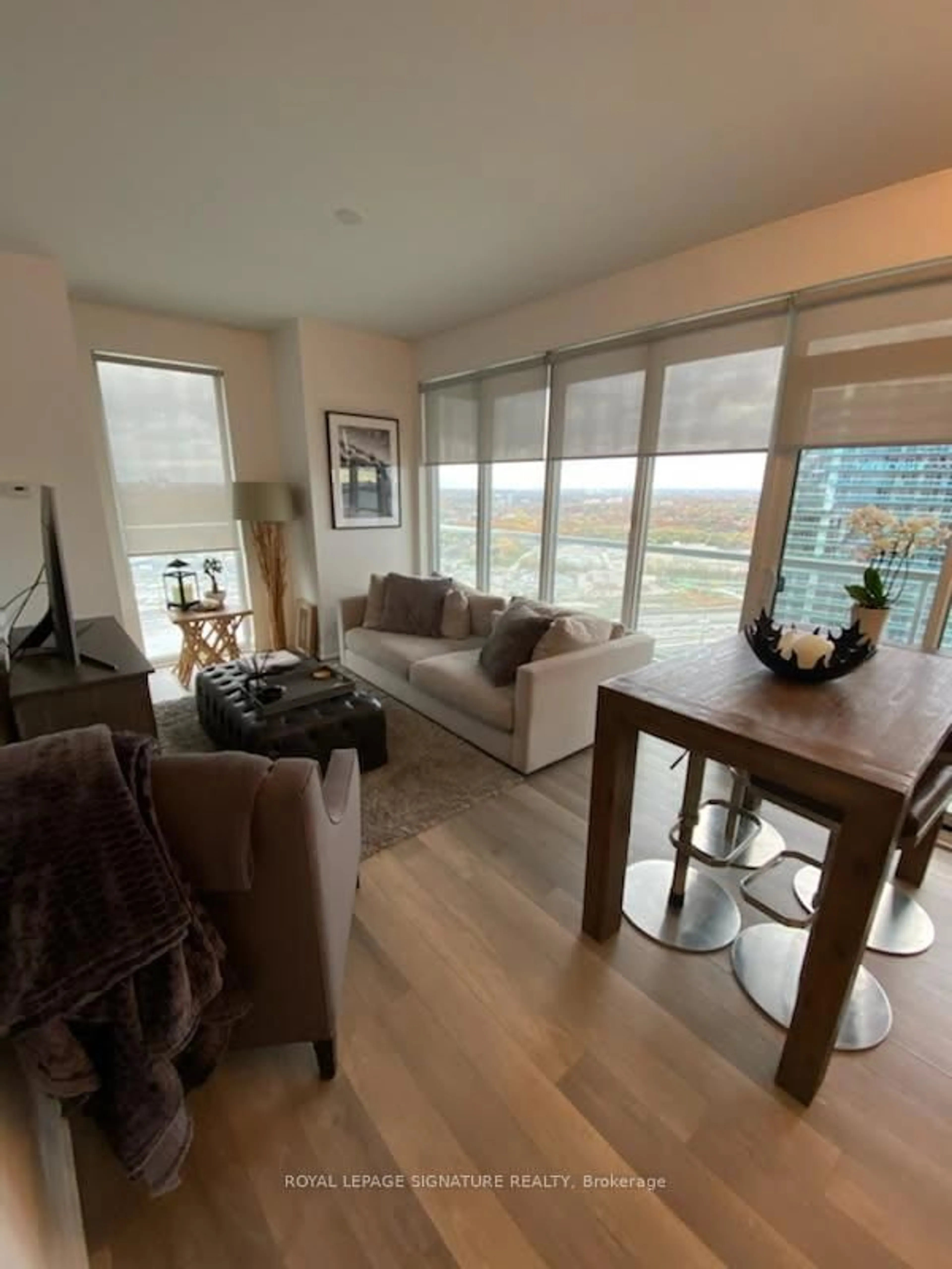 Living room with furniture, wood/laminate floor for 56 Annie Craig Dr #3408, Toronto Ontario M8V 0C4