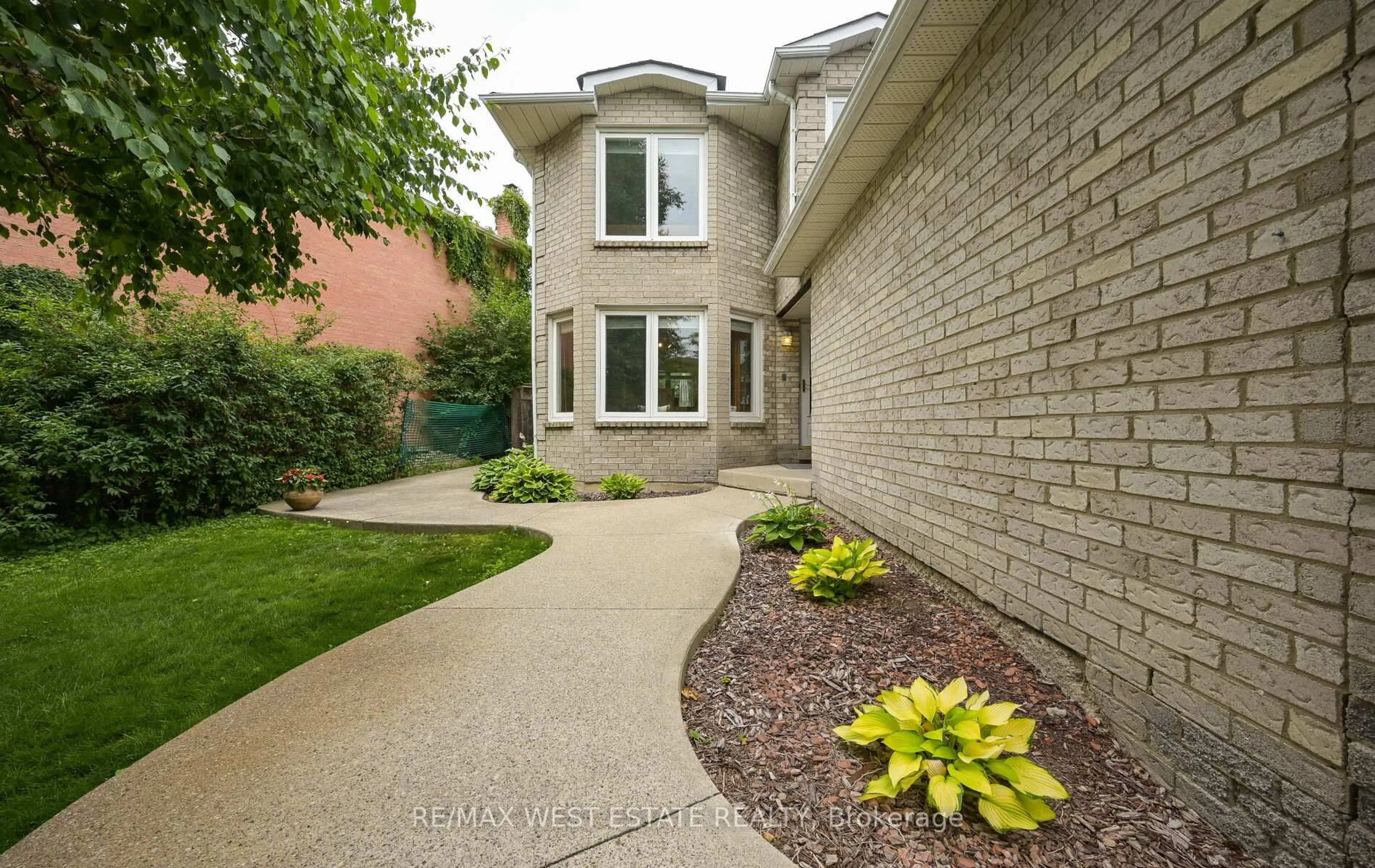 Home with brick exterior material, street for 66 La France Rd, Brampton Ontario L6S 4R2