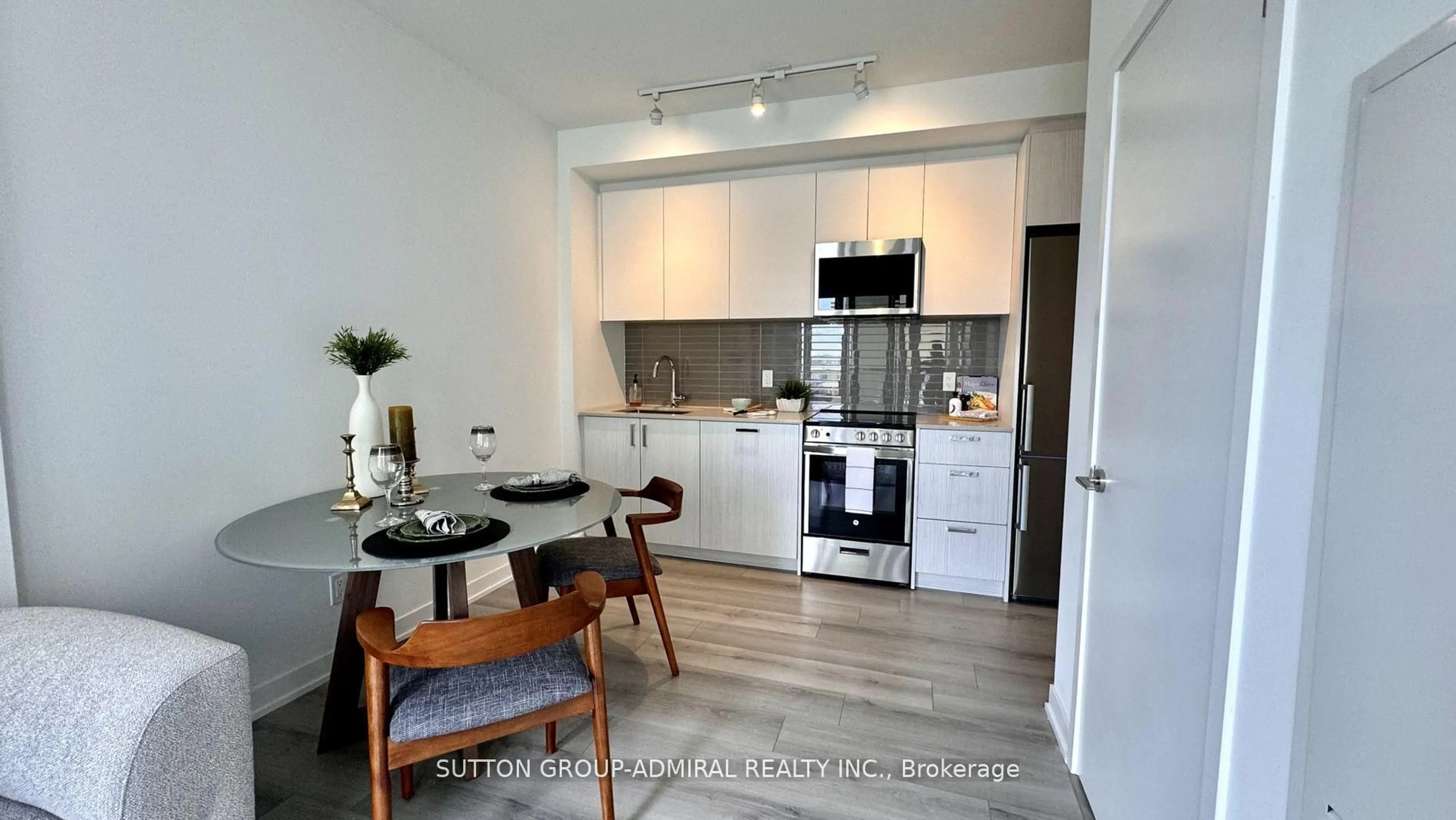 Open concept kitchen, wood/laminate floor for 1787 St. Clair Ave #1103, Toronto Ontario M6N 0B7