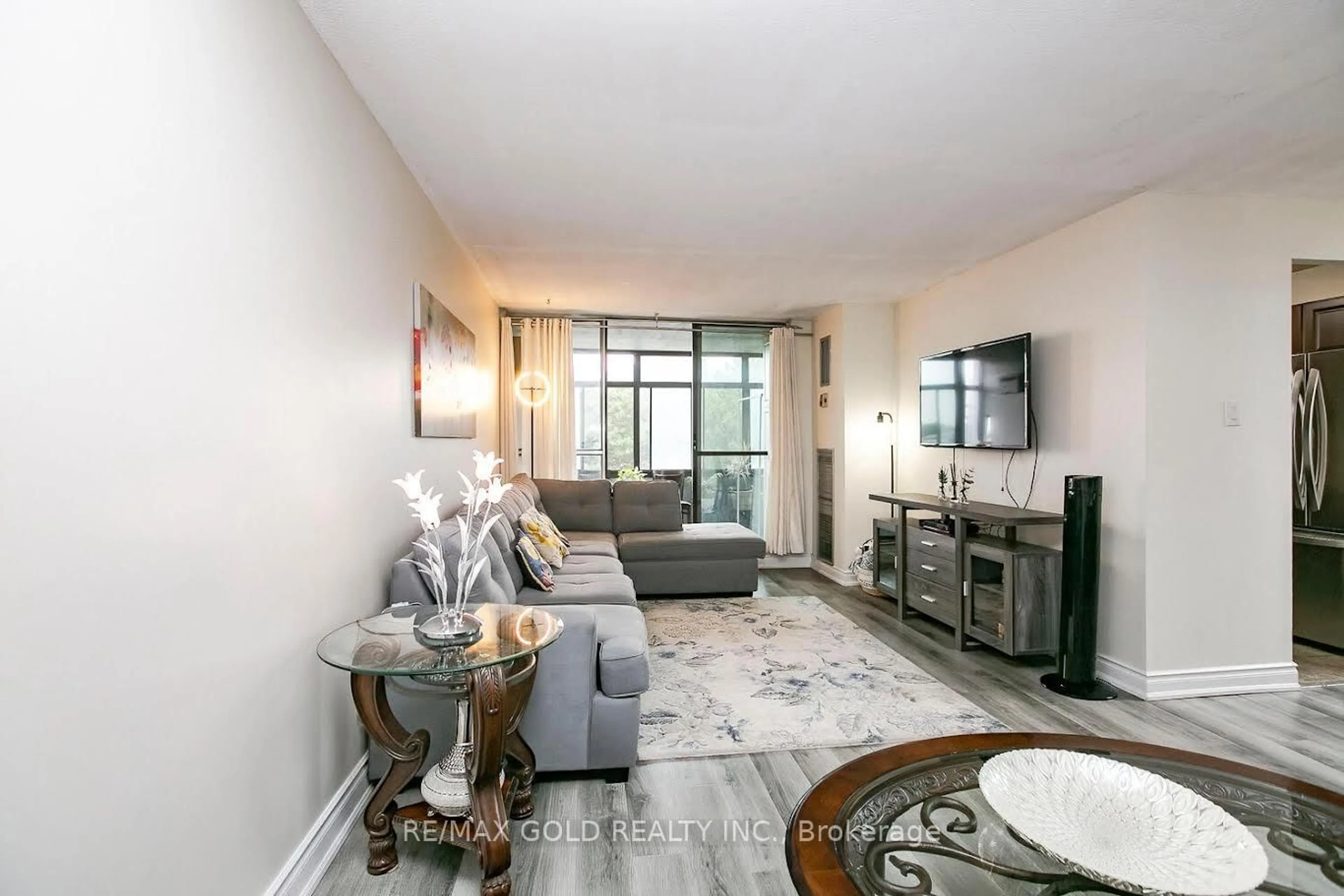 Living room with furniture, unknown for 15 Kensington Rd #312, Brampton Ontario L6T 3W2