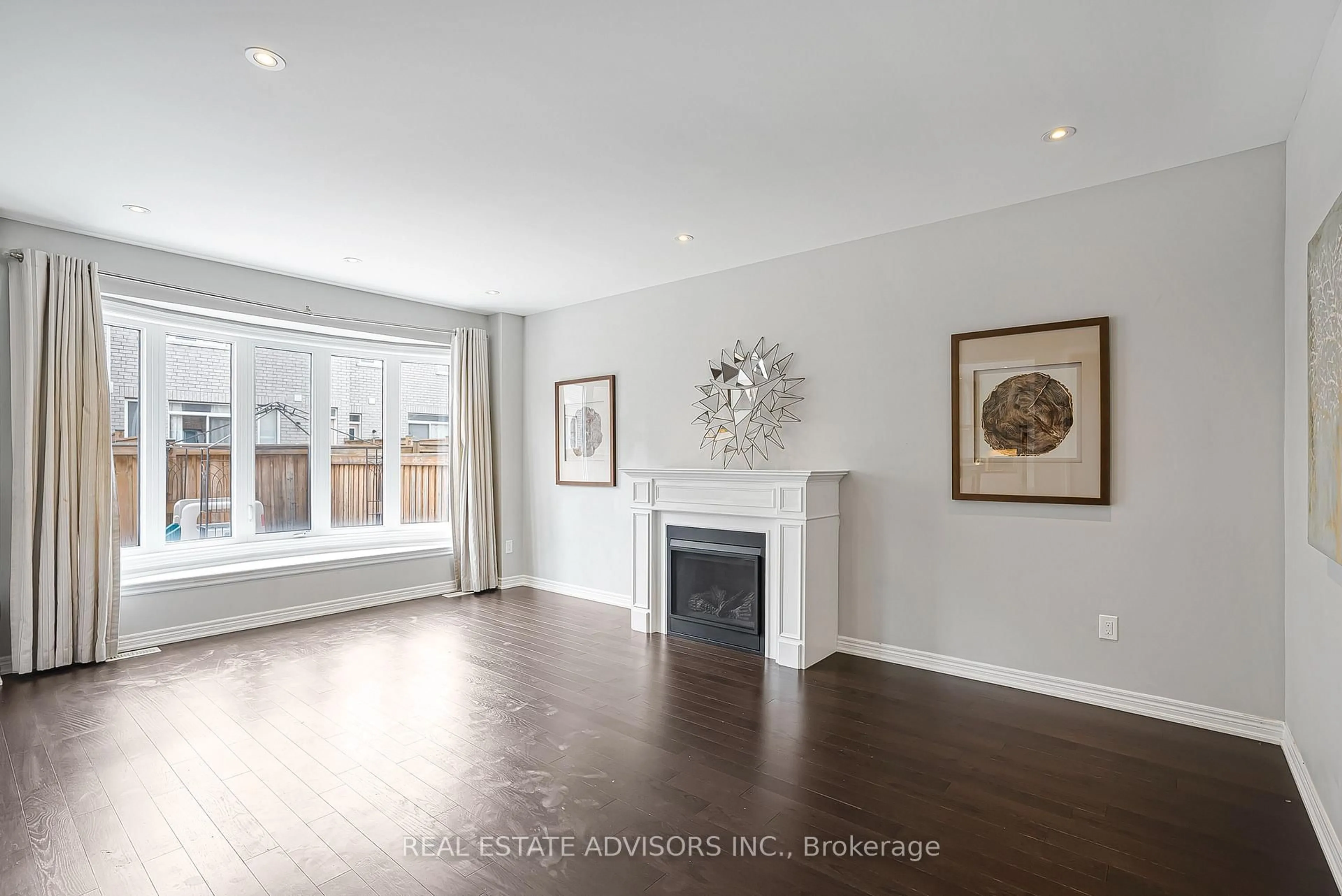 Living room with furniture, wood/laminate floor for 312 Buick Blvd, Brampton Ontario L7A 4L8