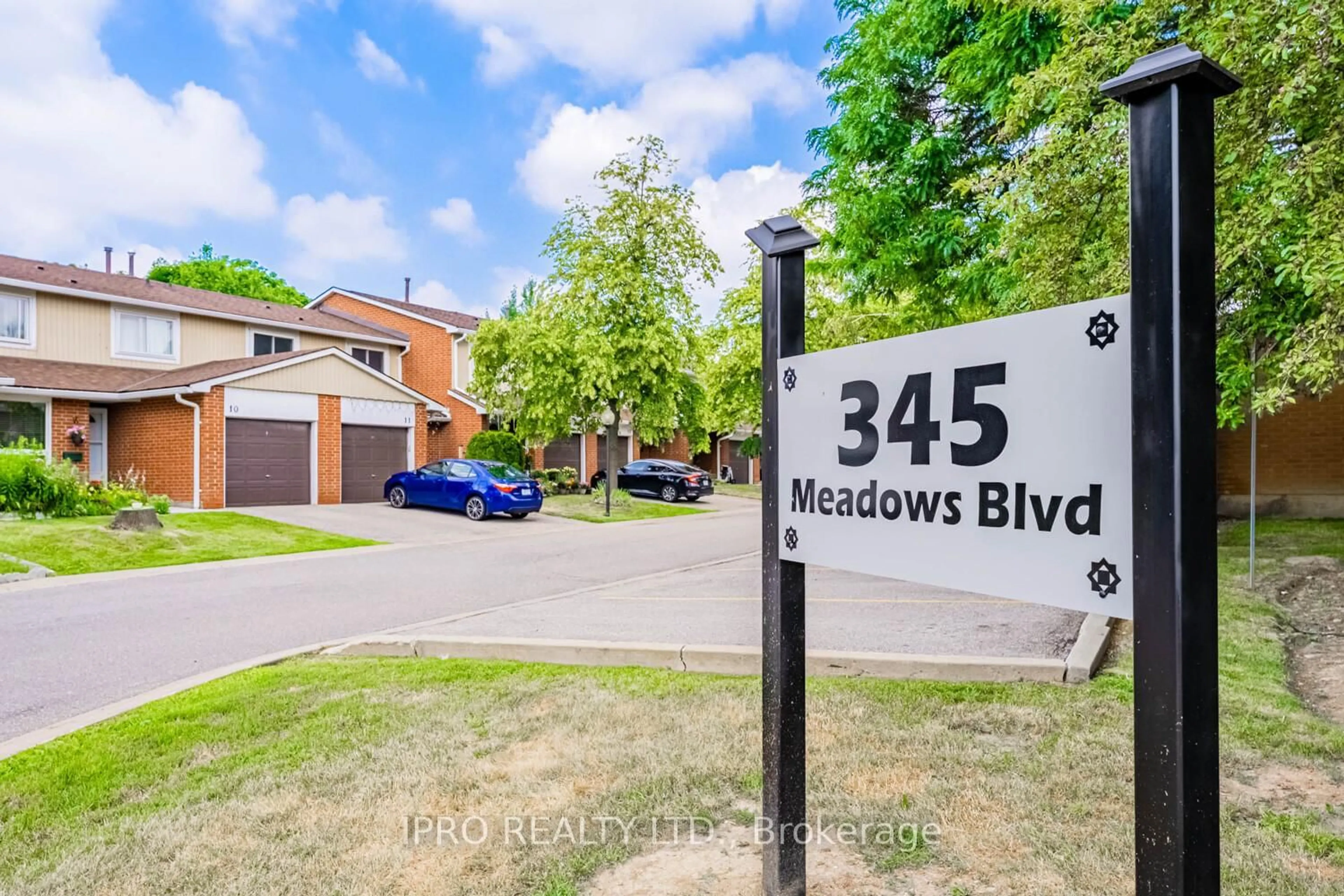A pic from outside/outdoor area/front of a property/back of a property/a pic from drone, street for 345 Meadows Blvd #19, Mississauga Ontario L4Z 1G5