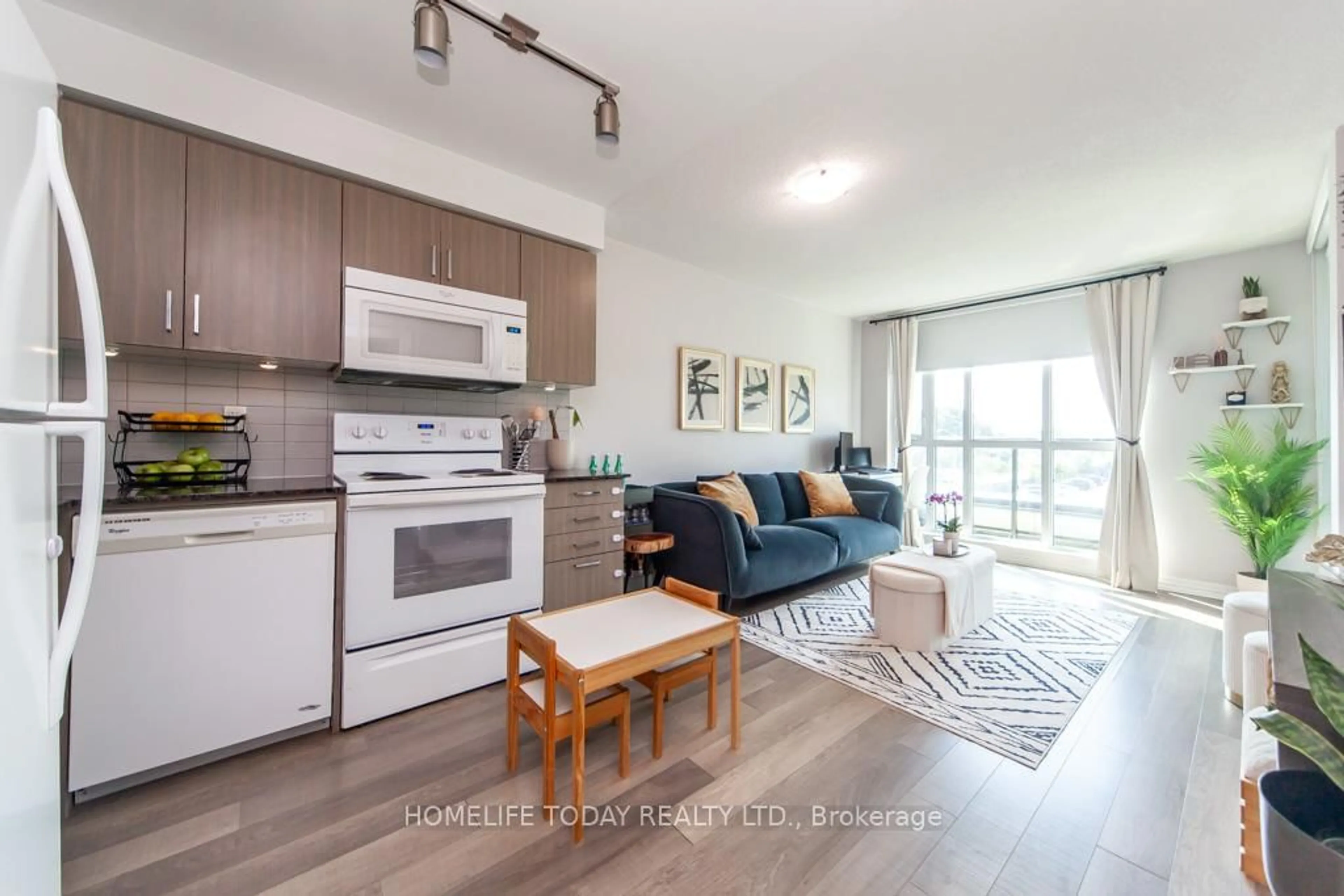 Open concept kitchen, wood/laminate floor for 80 Esther Lorrie Dr #313, Toronto Ontario M9W 0C6