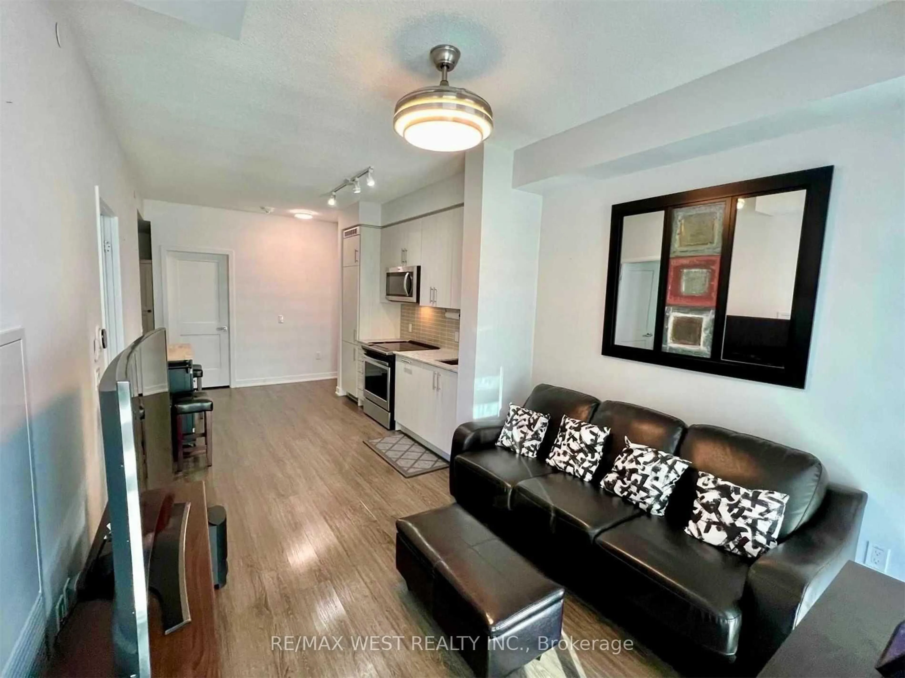 Living room with furniture, wood/laminate floor for 4085 Parkside Village Dr #1606, Mississauga Ontario L5B 0K9