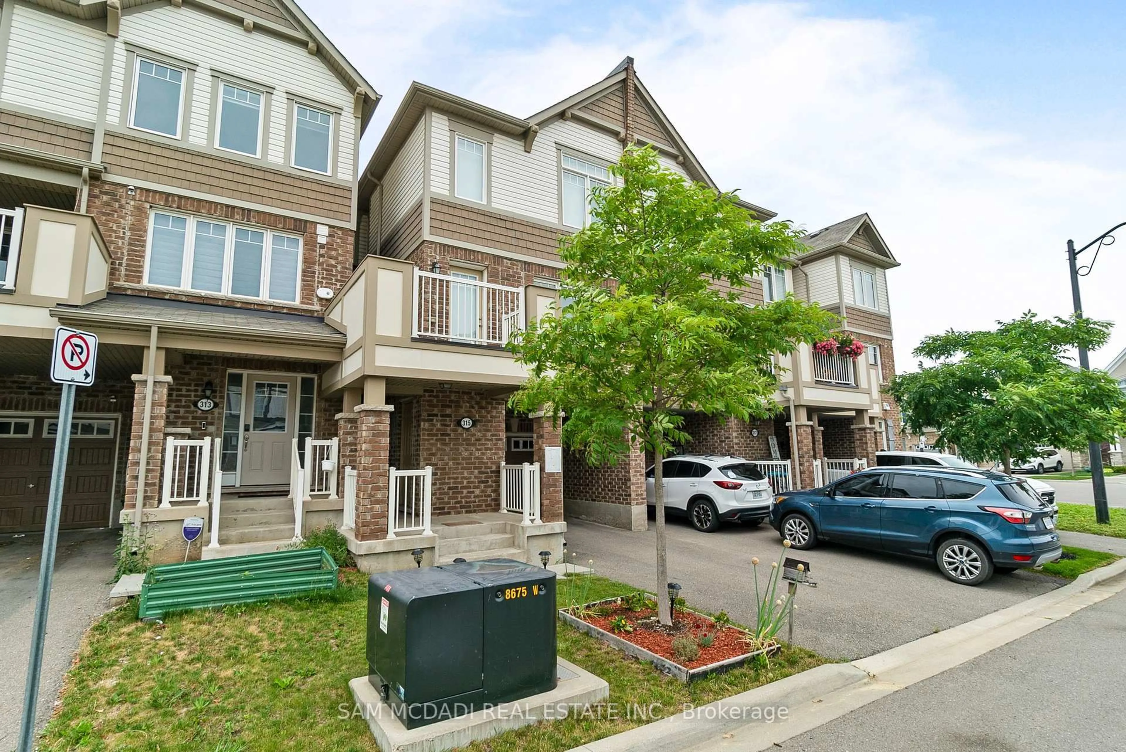 A pic from outside/outdoor area/front of a property/back of a property/a pic from drone, street for 315 Murlock Hts, Milton Ontario L9E 1C3
