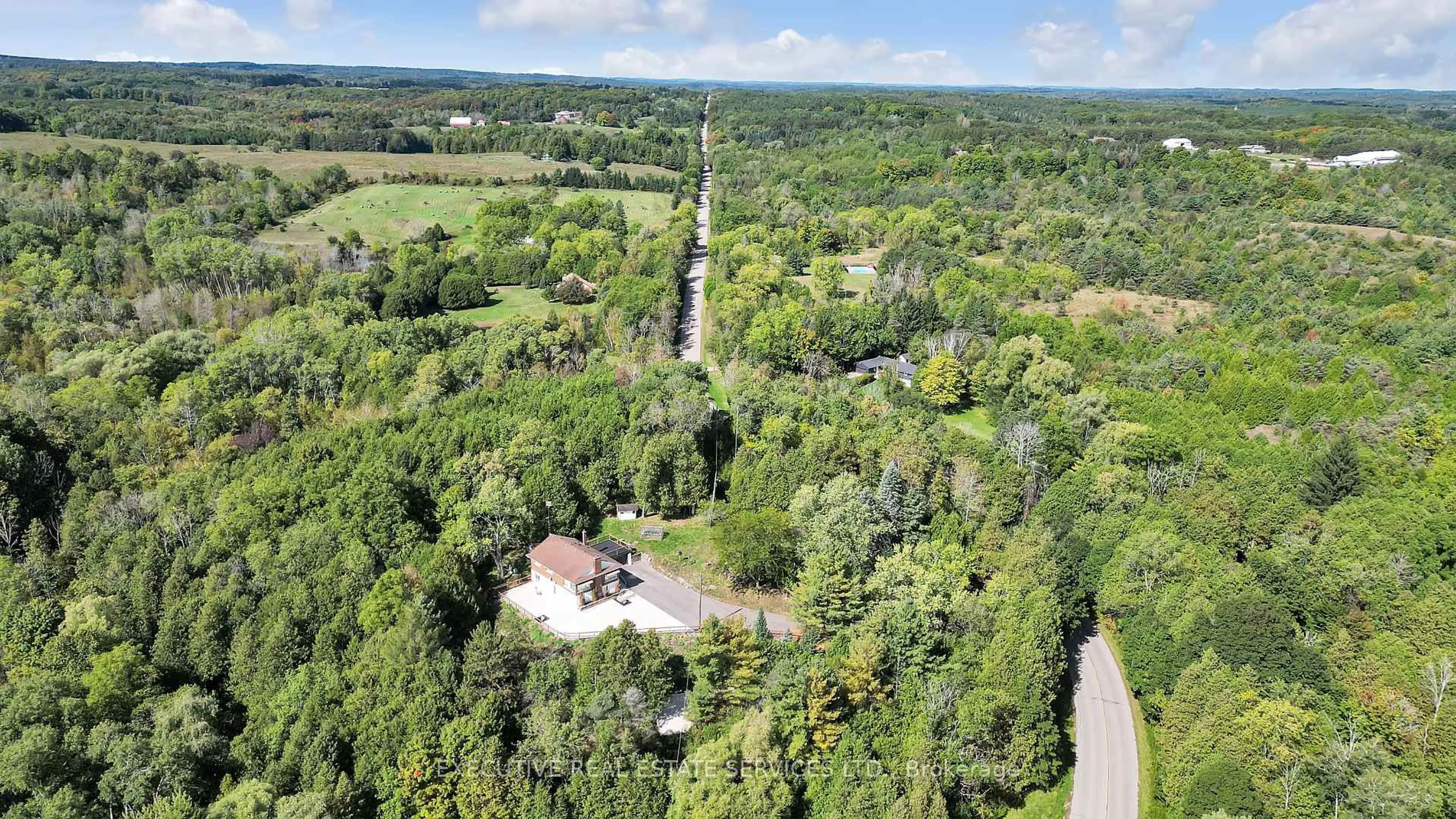 A pic from outside/outdoor area/front of a property/back of a property/a pic from drone, forest/trees view for 16198 Centreville Creek Rd, Caledon Ontario L7C 3B4
