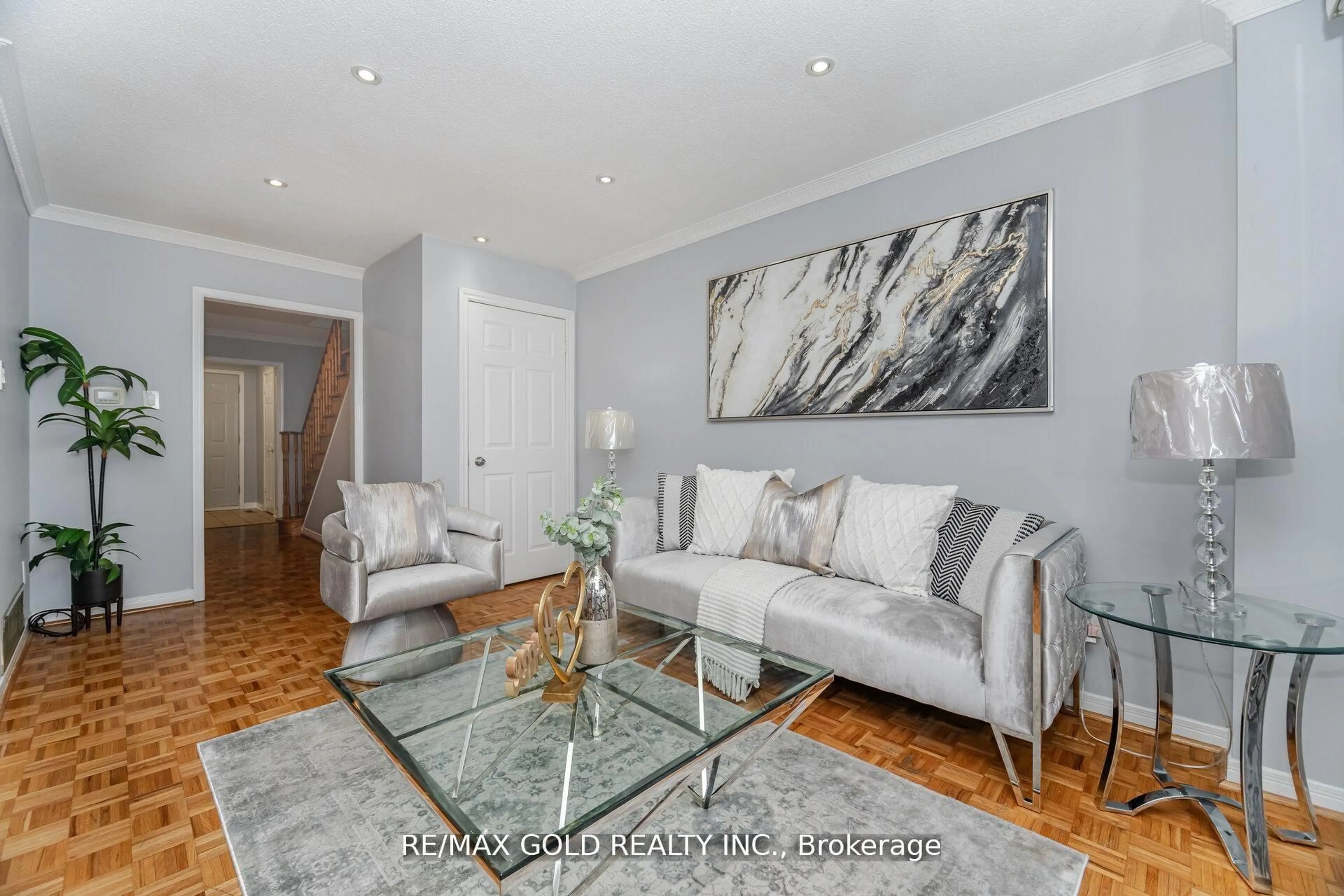 Living room with furniture, wood/laminate floor for 58 Kesteven Cres, Brampton Ontario L6W 4E5
